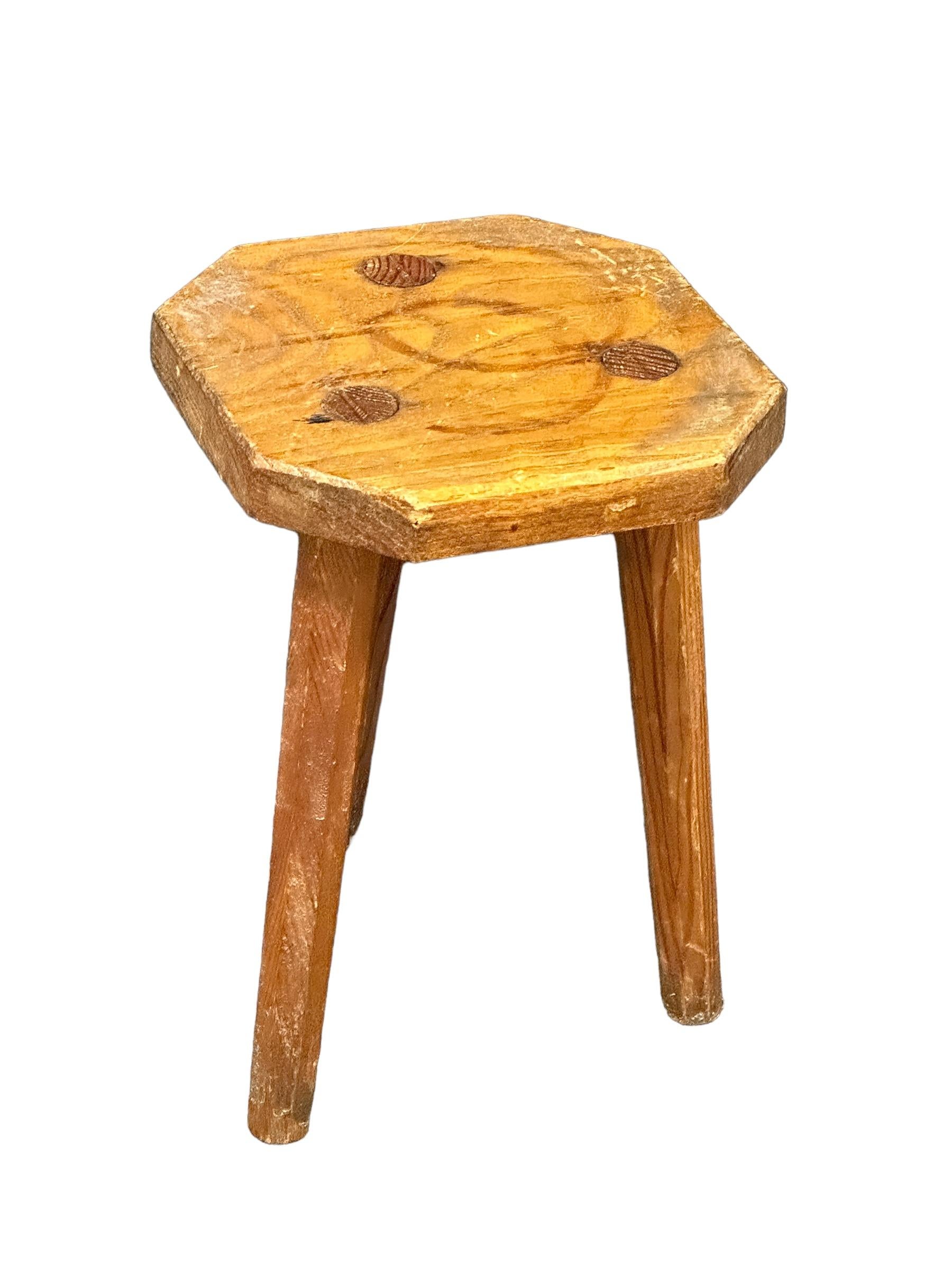 This early 20th century wabi sabi 3 leg workshop stool from Italy is an excellent example of this style. The piece has a octagonal, rustic-looking seat made of wood and is supported by three legs. The stool has a simple, understated design which is