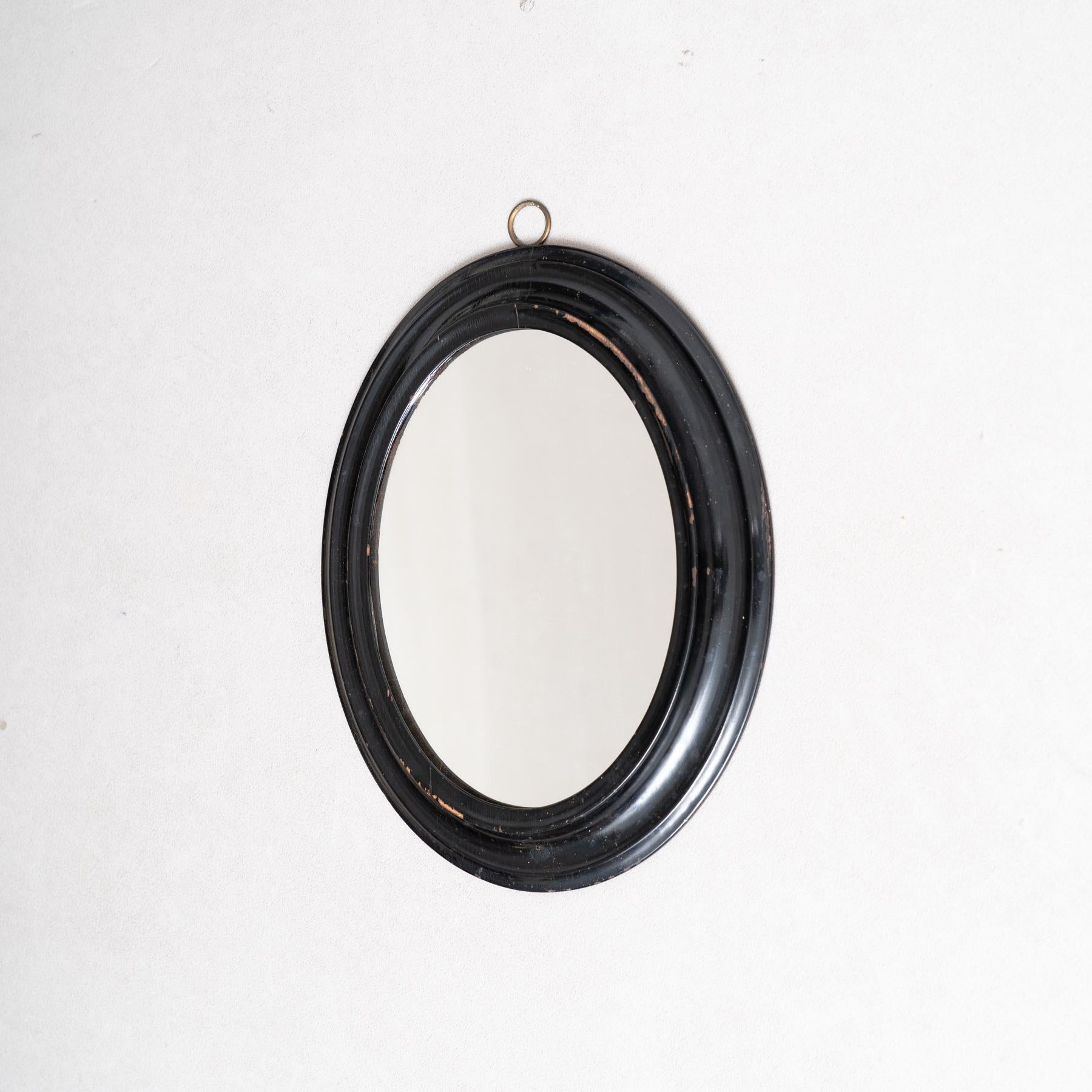Français Miroir mural du début du 20e siècle - Cadre ovale laqué noir en vente