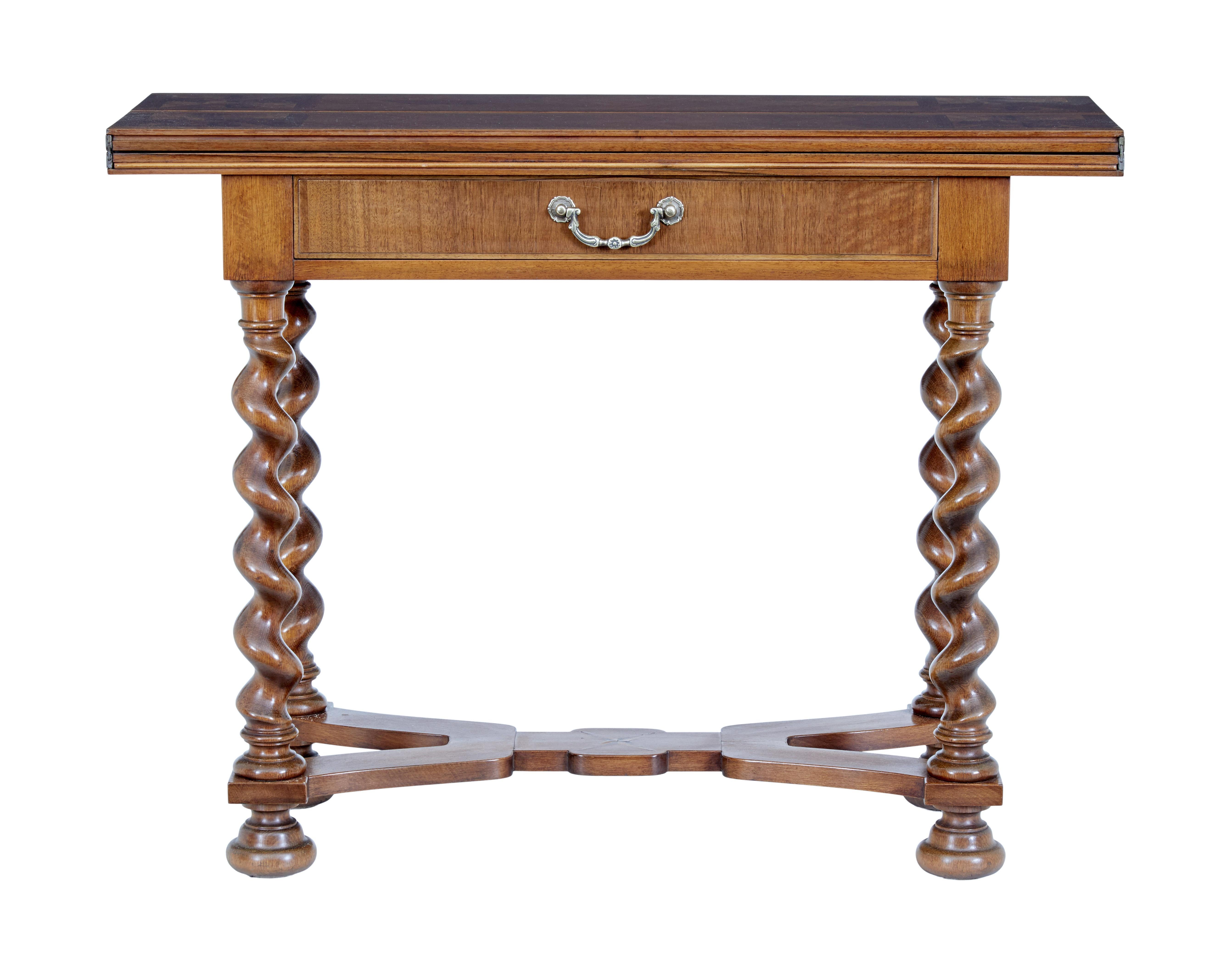 20th century walnut flip top occasional table circa 1930.

Practical occasional table in the Queen Anne taste. Single drawer table that doubles the area with a flip top action. Cross-banded top with a patterned veneer arrangement. Standing on