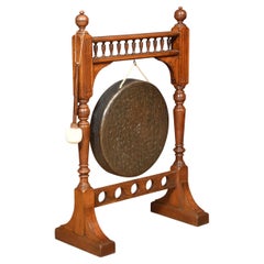 Early 20th century walnut framed dinner gong