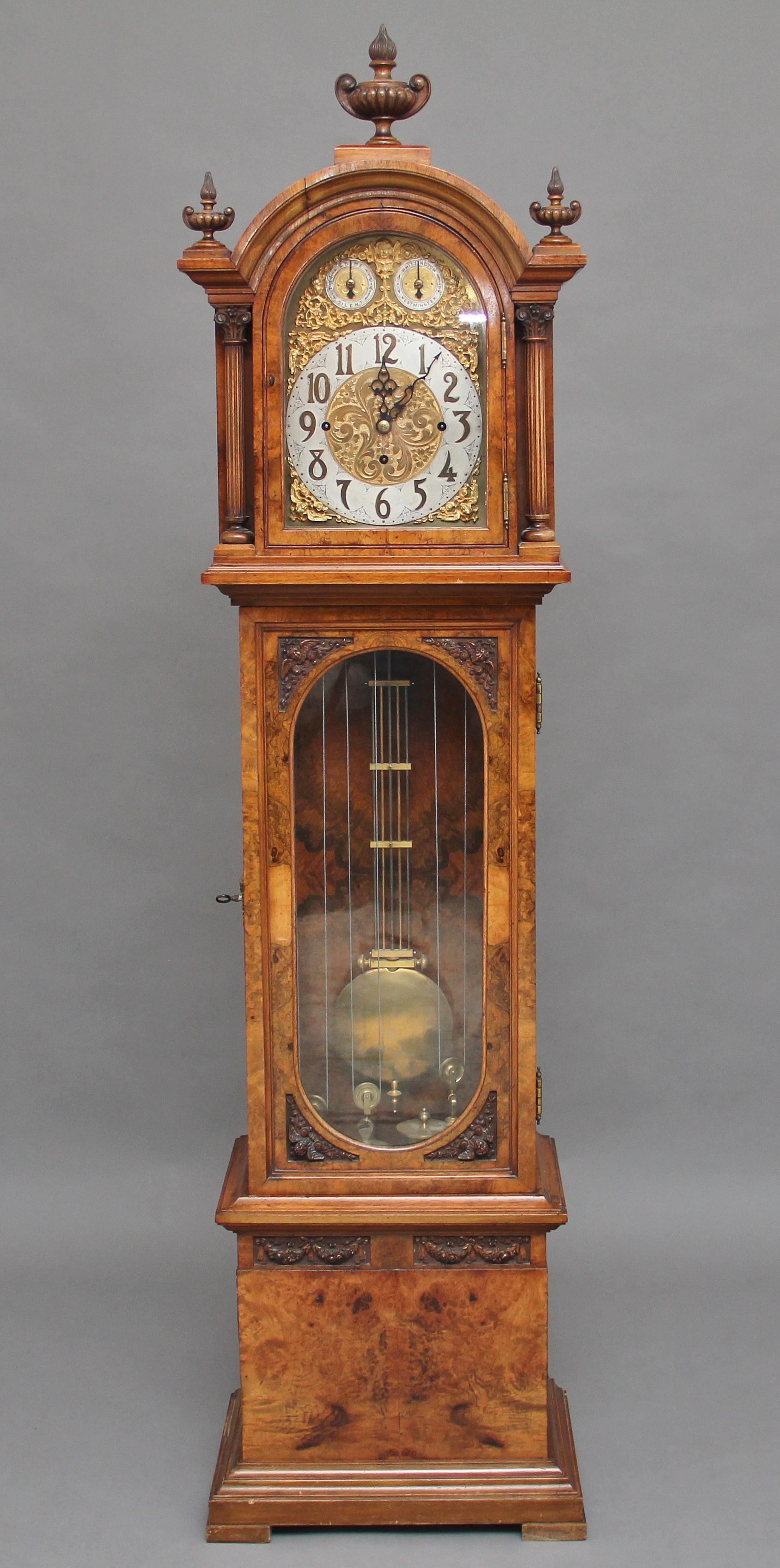 A lovely quality early 20th century walnut Granddaughter clock, features a substantial three train dead beat escapement movement with Whittington and Westminster chime on eight gongs on the quarters and with an hourly strike on a single gong, fine
