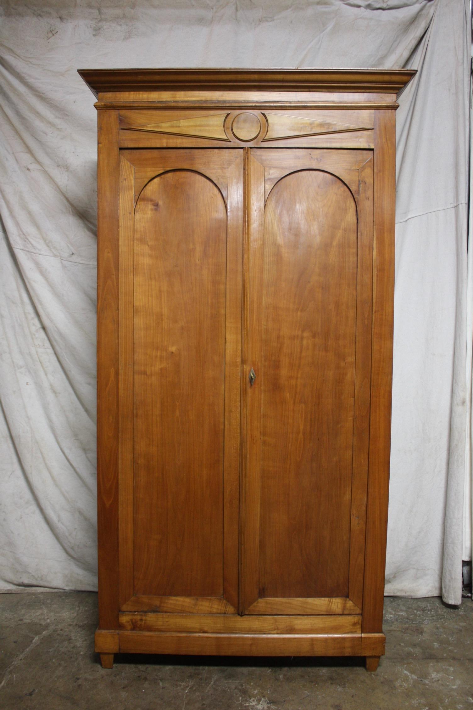 Small, tall and narrow Armoire, nice blond walnut, very interesting by its proportion, simple and elegant.