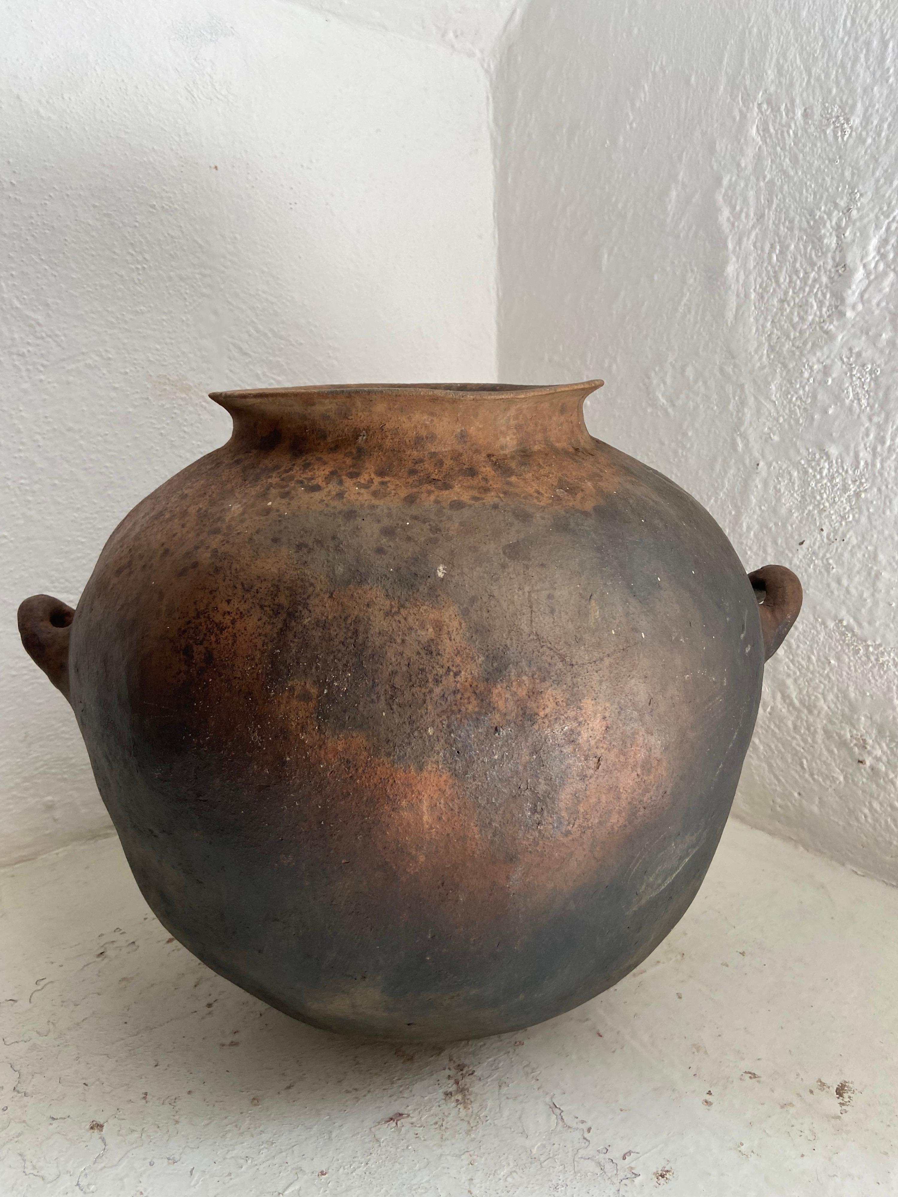 Early 20th century water jar from Northern Puebla, Mexico. From the Nahua indigenous communities of the northern territory bordering the state of Veracruz. This style of pottery was discontinued with the introduction of plastics in the sixties and