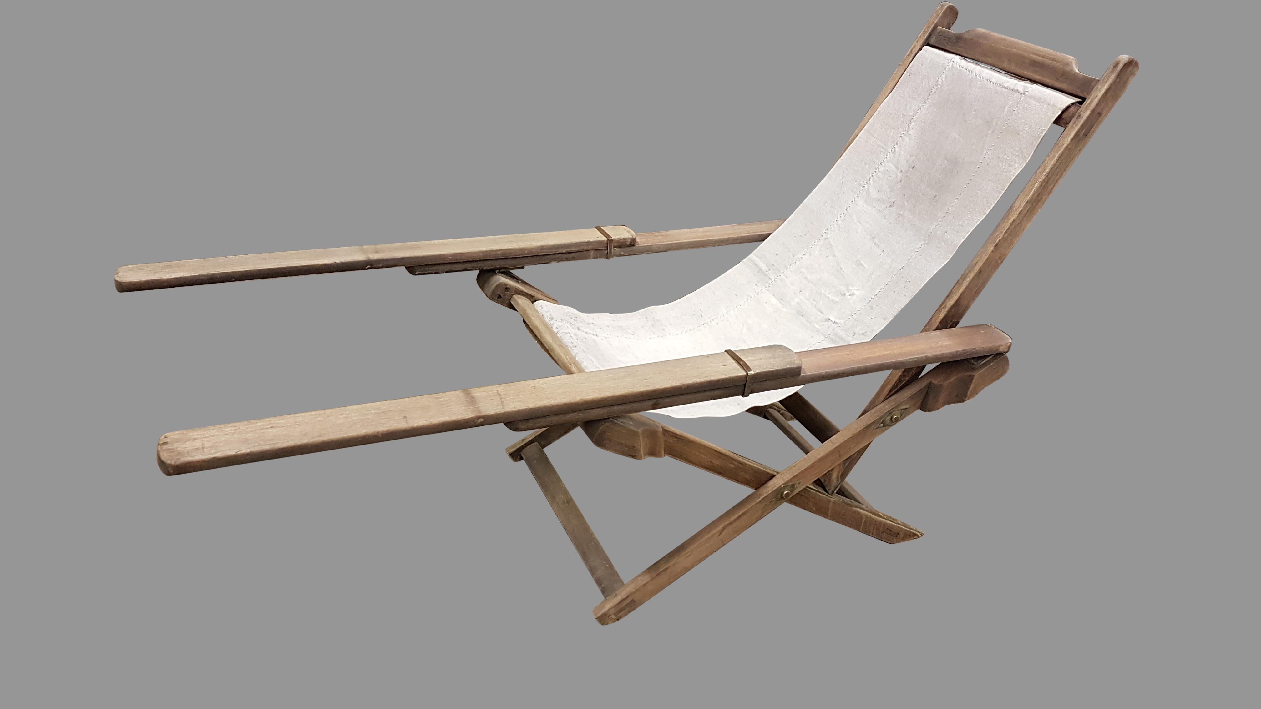 A very nice and quirky early 20th century weathered teak plantation lounger chair, it has three reclining positions and the original canvas slung seat, which although original could be replaced. The finish has a lovely weathered dry appearance and