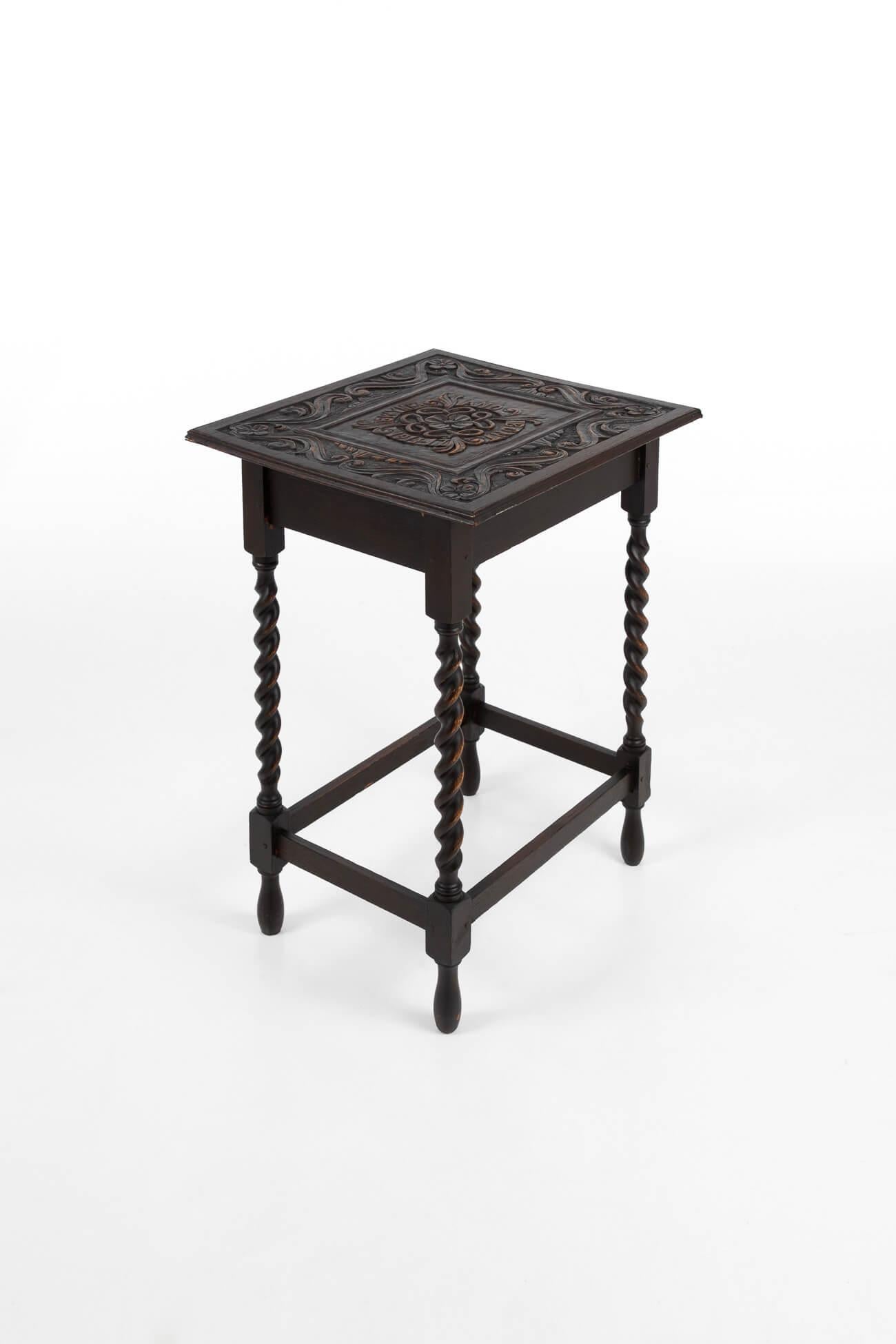 Early 20th century Welsh barley twist occasional table. Made of oak with an intricately hand-carved top inscribed ‘ Gwynfa and Bont 1914-17’ in commemoration of those who fought in WW1. Supported by hand-turned barley twist legs, joined by simple