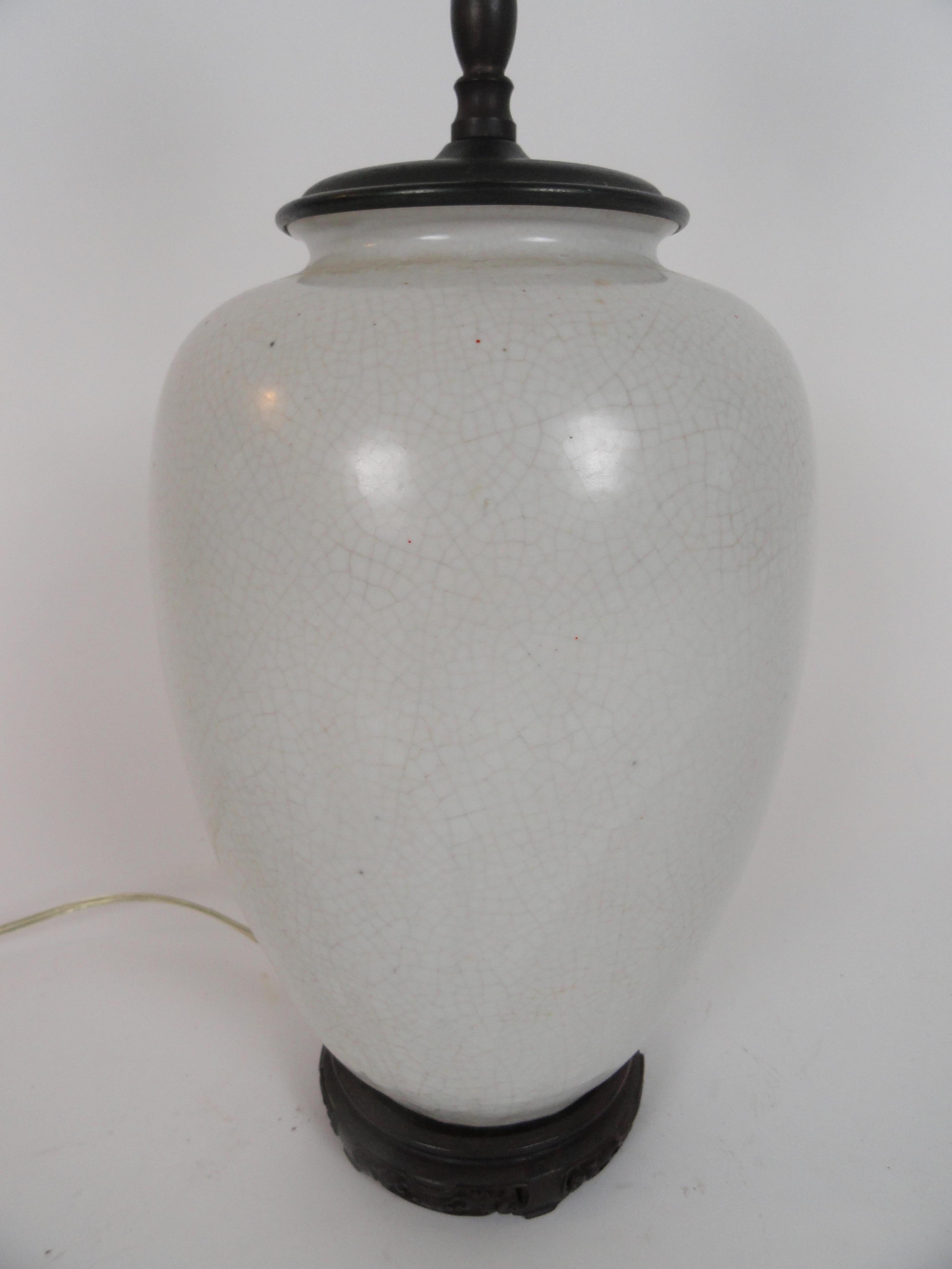 Oriental white crackle lamp featuring a wabi sabi finish, early 20th century. On custom teak base.