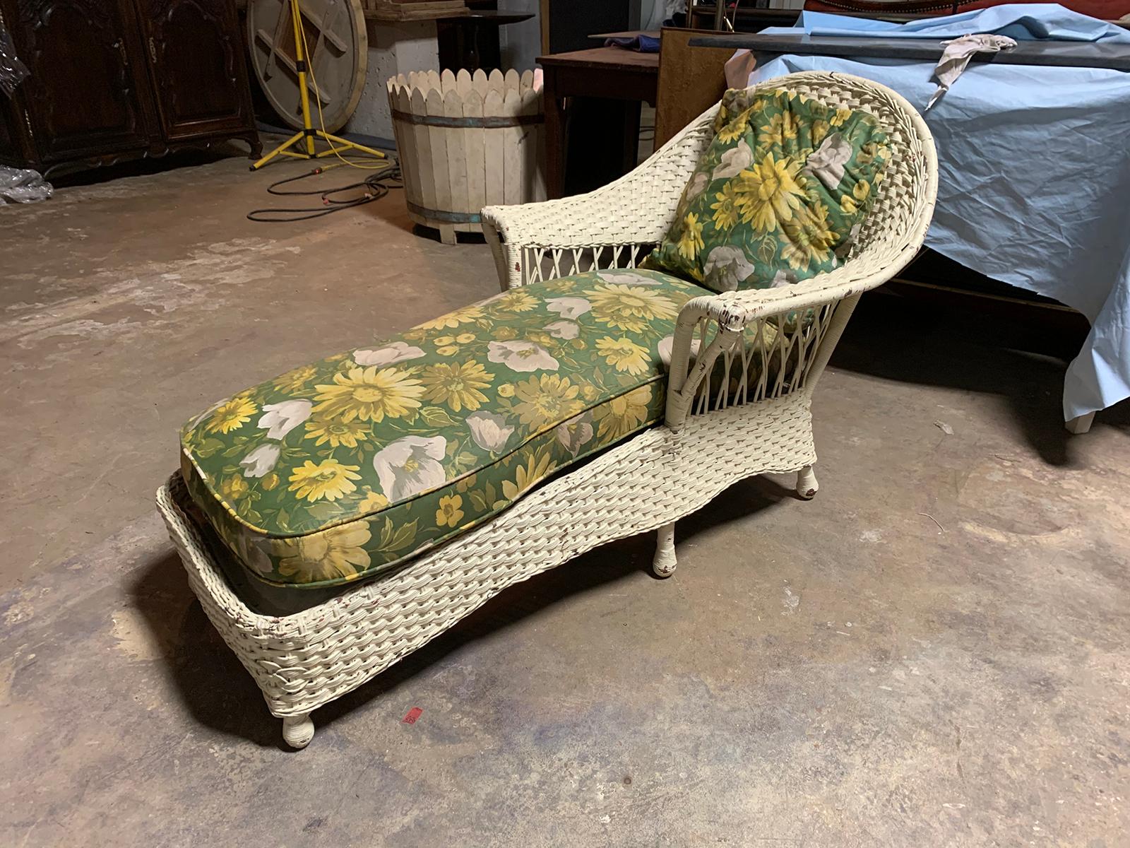 Early 20th century wicker chaise with green floral upholstery and pillow
Measures: 30