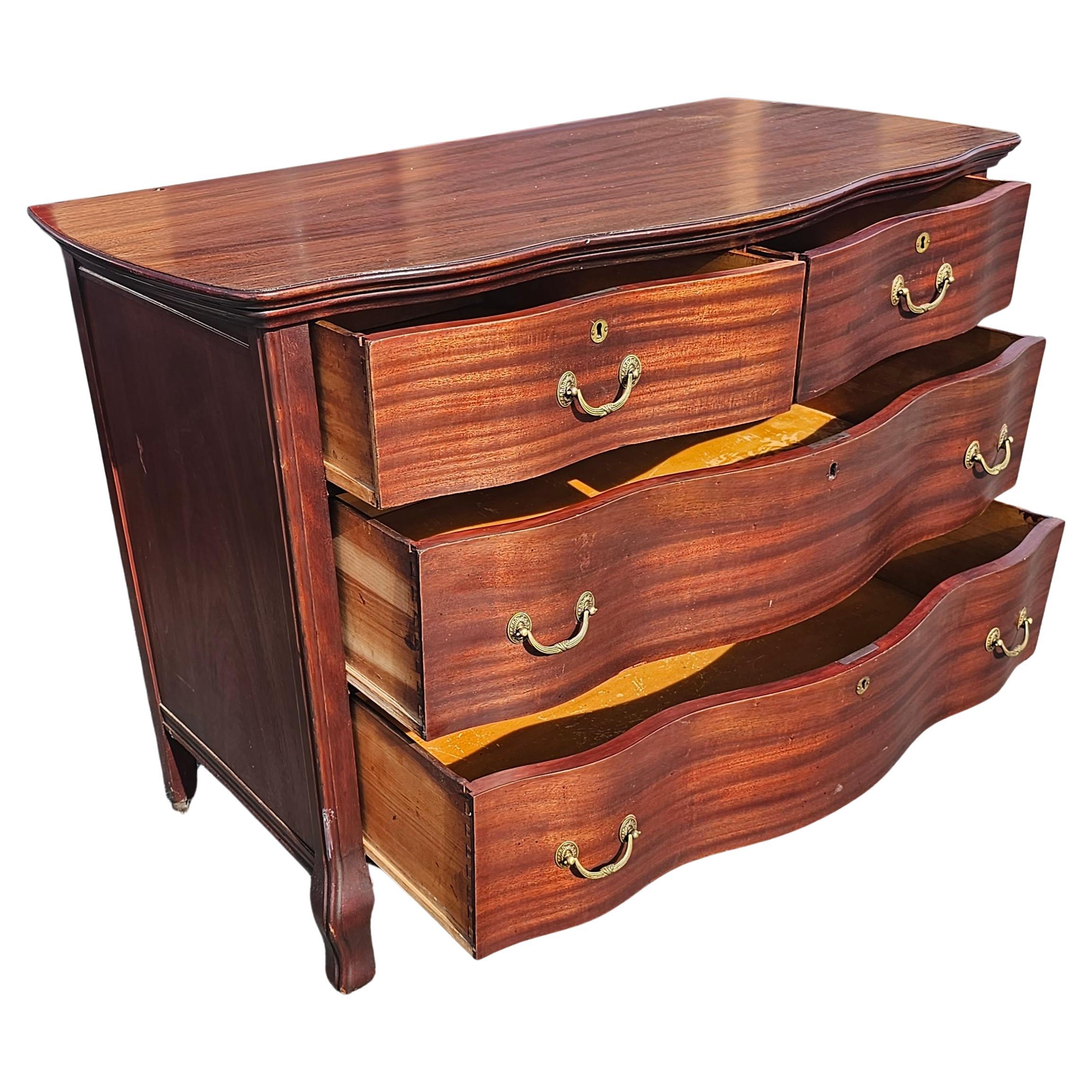 Early 20th Century Widdicomd Tiger Mahogany Serpentine Commode Chest on Wheels In Good Condition For Sale In Germantown, MD