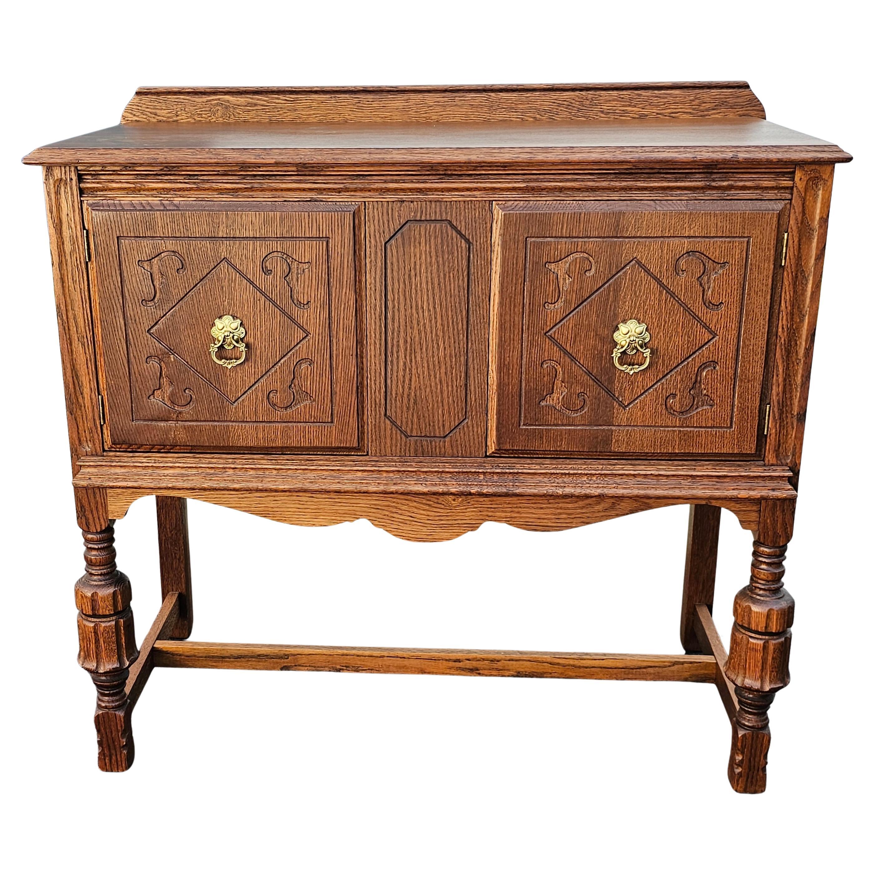 Early 20th Century William and Mary Style Carved and Stain Oak Server For Sale