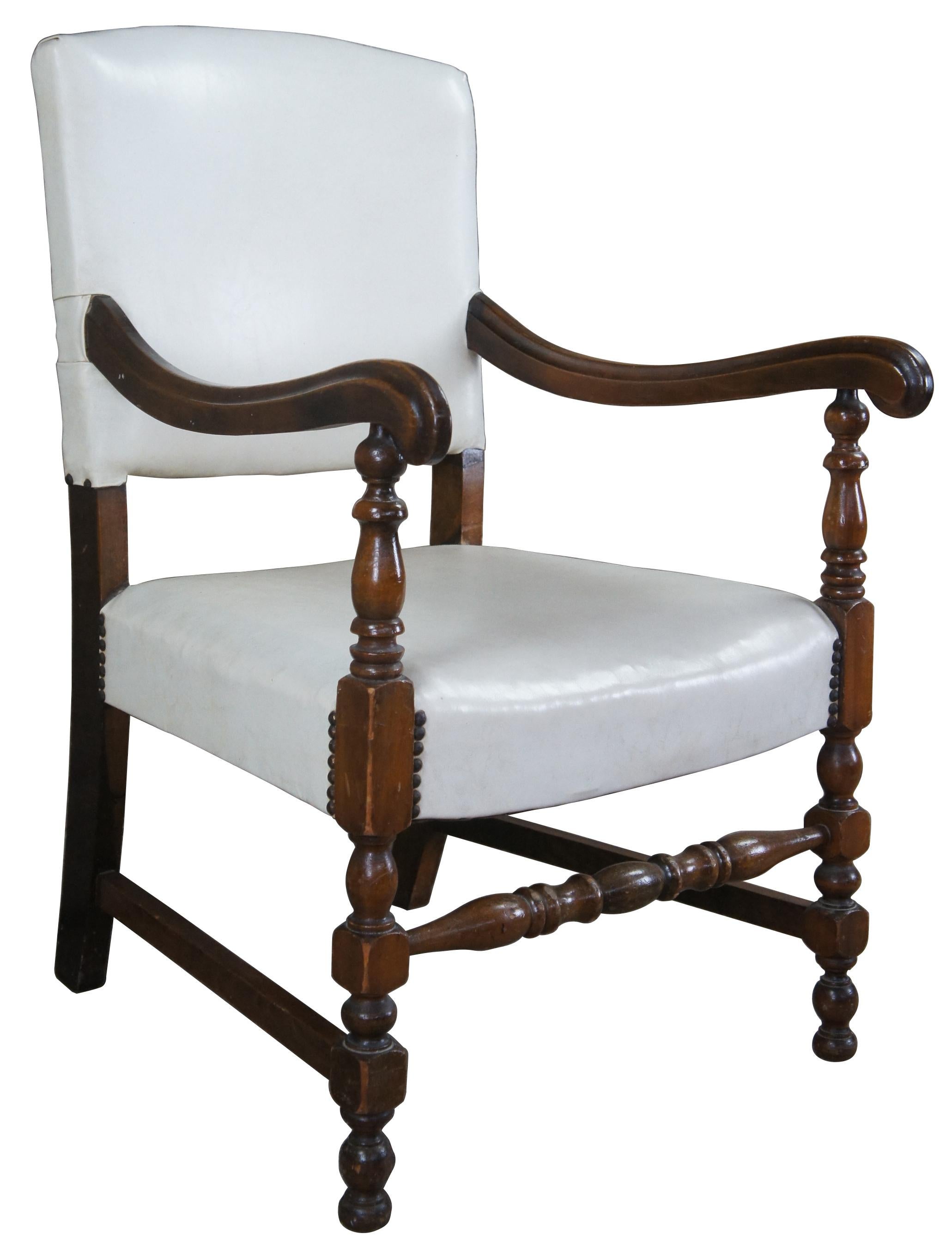 Early 20th century William and Mary arm chair. Made of mahogany featuring scrolled arms and white leather with nailhead trim.