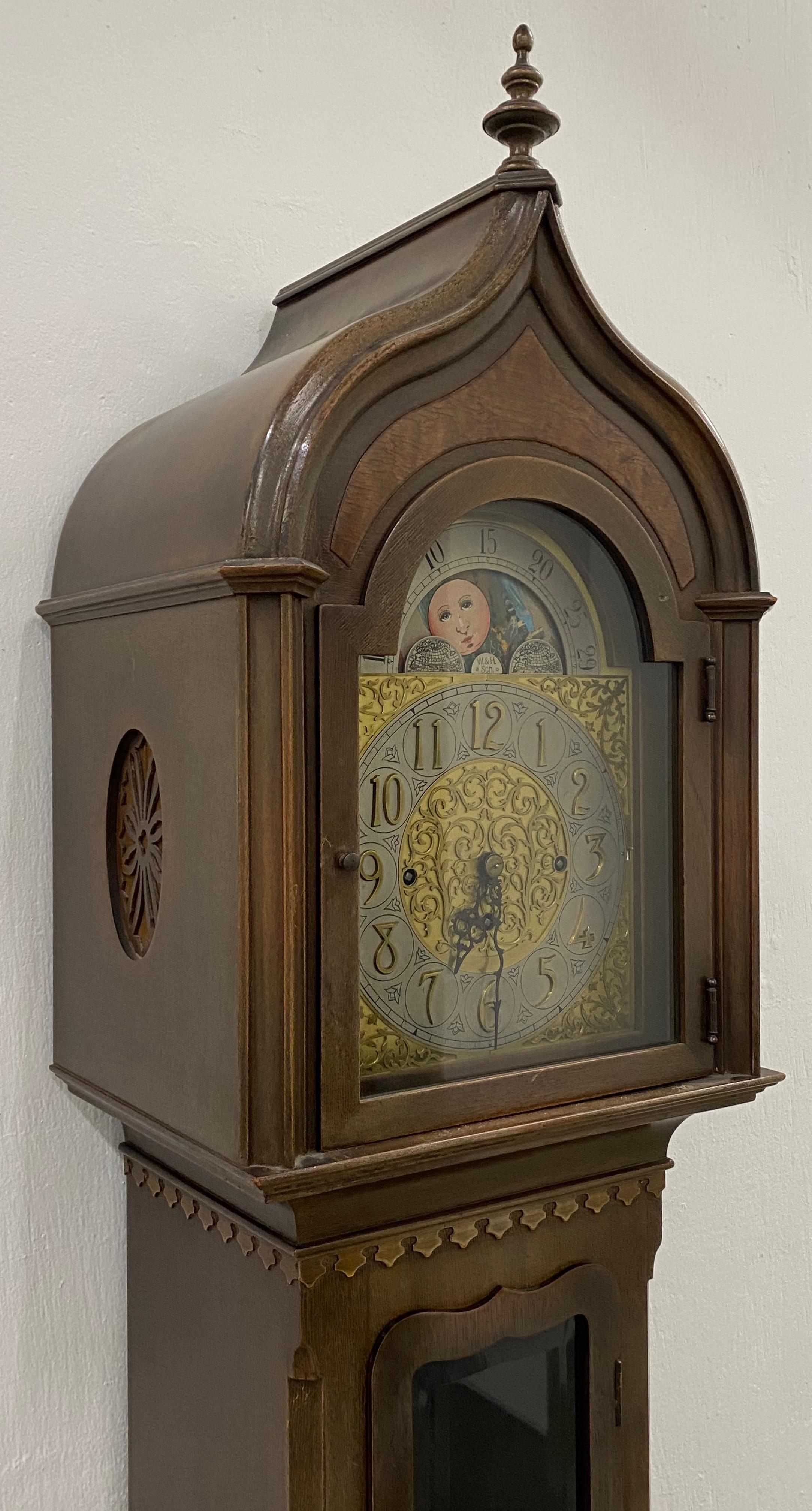 Early 20th century Winterhalder & Hofmeier tall case clock with moon face

Lovely old tall case German clock.

The clock has three heavy weights and a pendulum. The hand painted face shows minimal paint loss. As the hours turn, the face shows