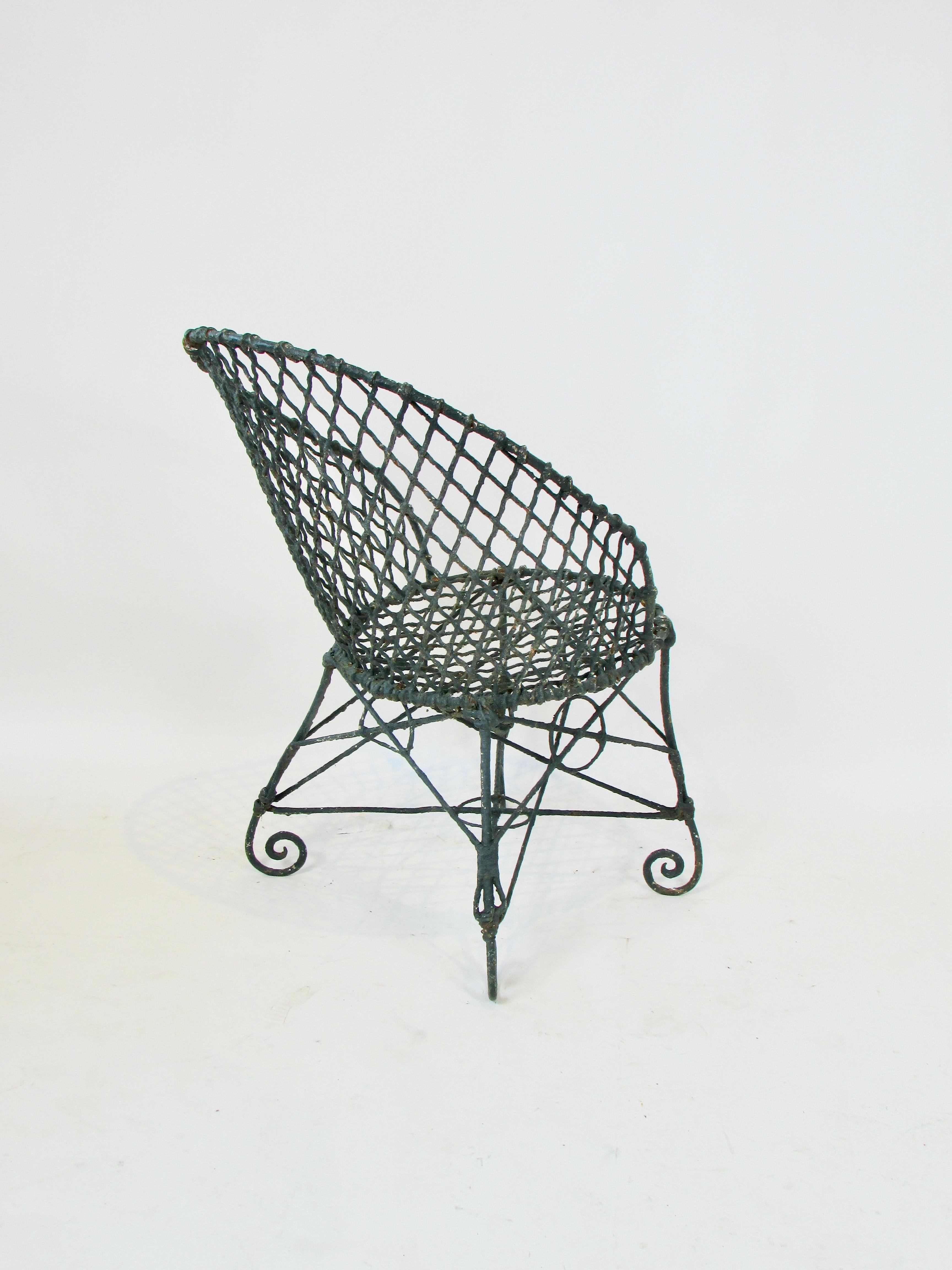 American Early 20th Century wire garden chair in old paint and patina