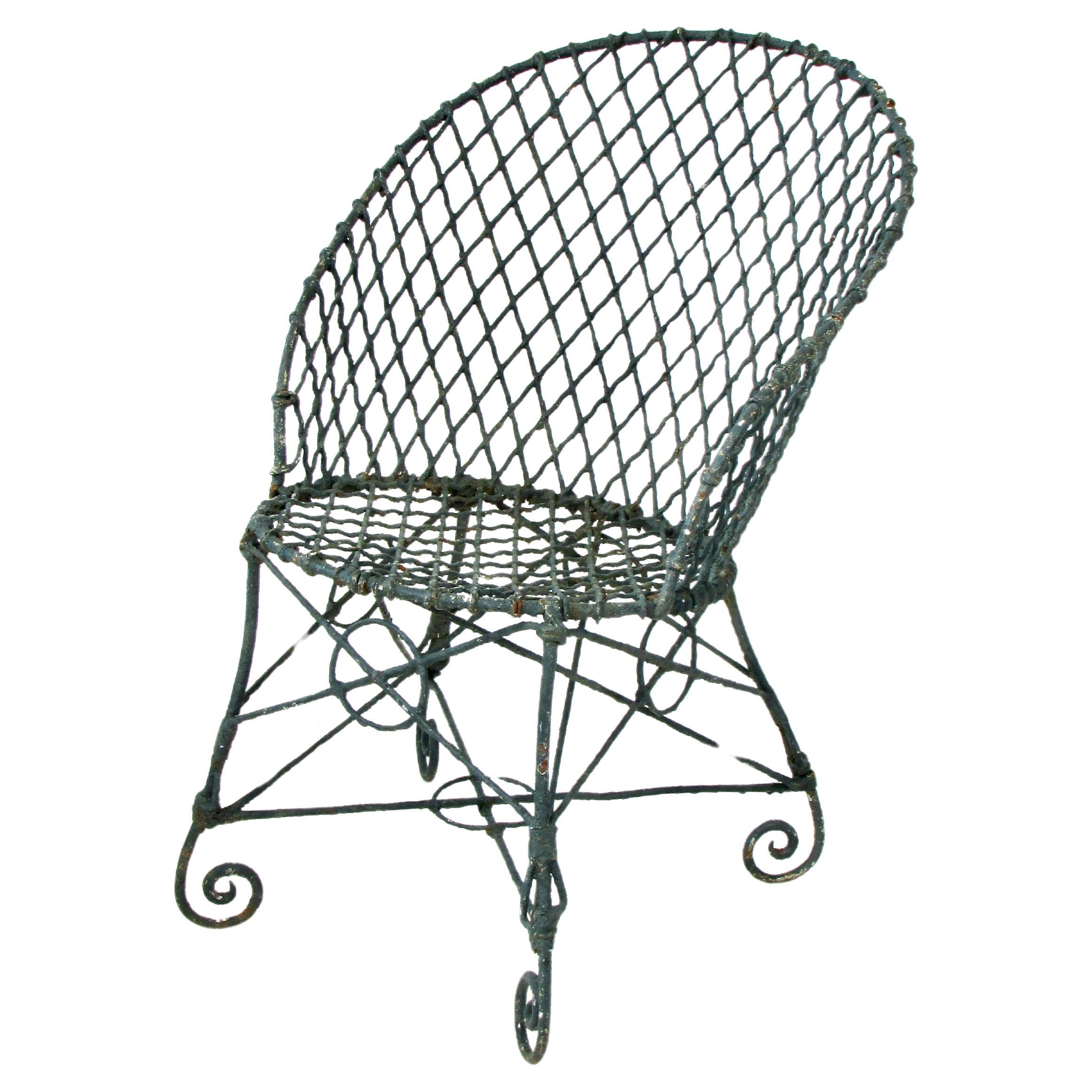 Early 20th Century wire garden chair in old paint and patina