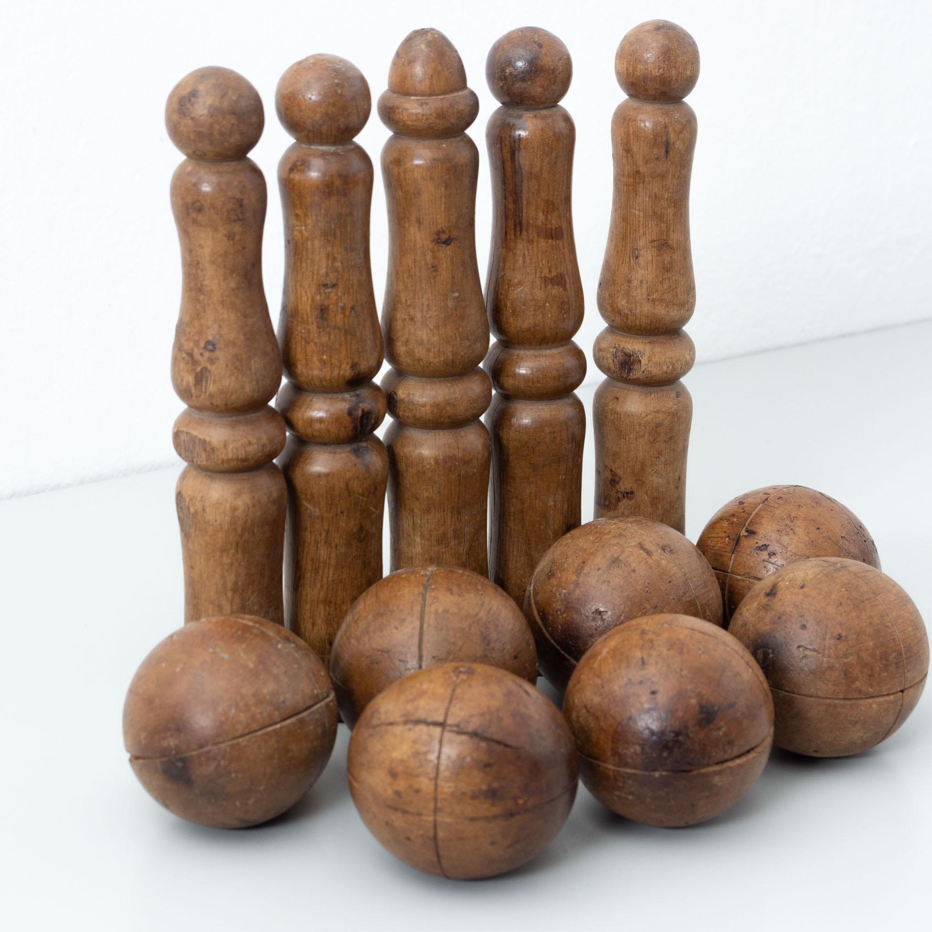 Traditional wood bowling game. 

Step back in time with this traditional wooden bowling game, a delightful piece of French history crafted by an unknown manufacturer circa early 20th century. This charming game set offers a glimpse into the past