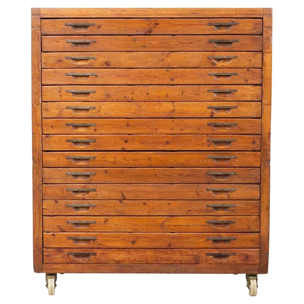 Unearth the charm of a vintage file cabinet hailing from the early 20th century, an intriguing creation by an unknown French manufacturer. This exquisite piece carries the whispers of history, maintaining its original condition with a grace that