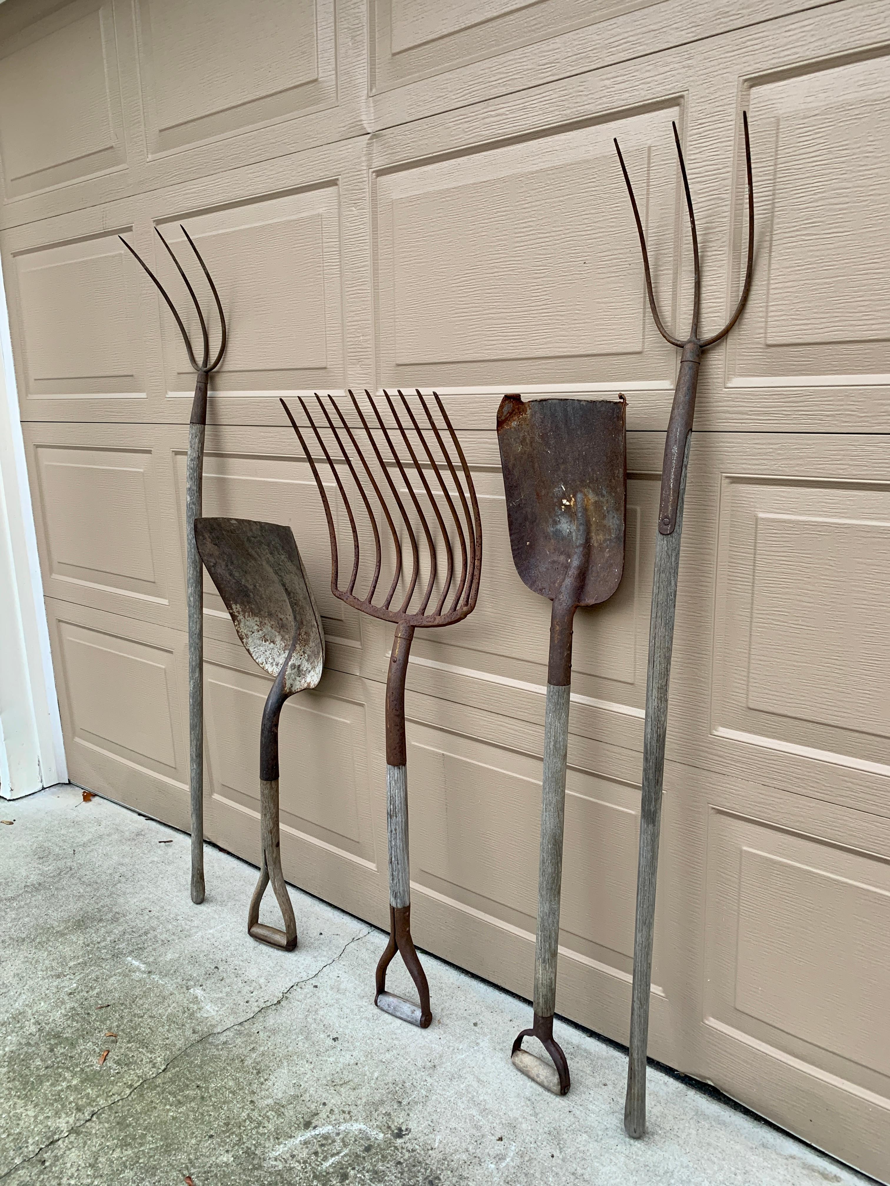 A beautiful set of five antique wooden & iron hand made garden tools. These would be ideal for an installation on a large wall on custom wall mounts. They would add the perfect dose of character to a country house or a farmhouse.

USA, Circa early