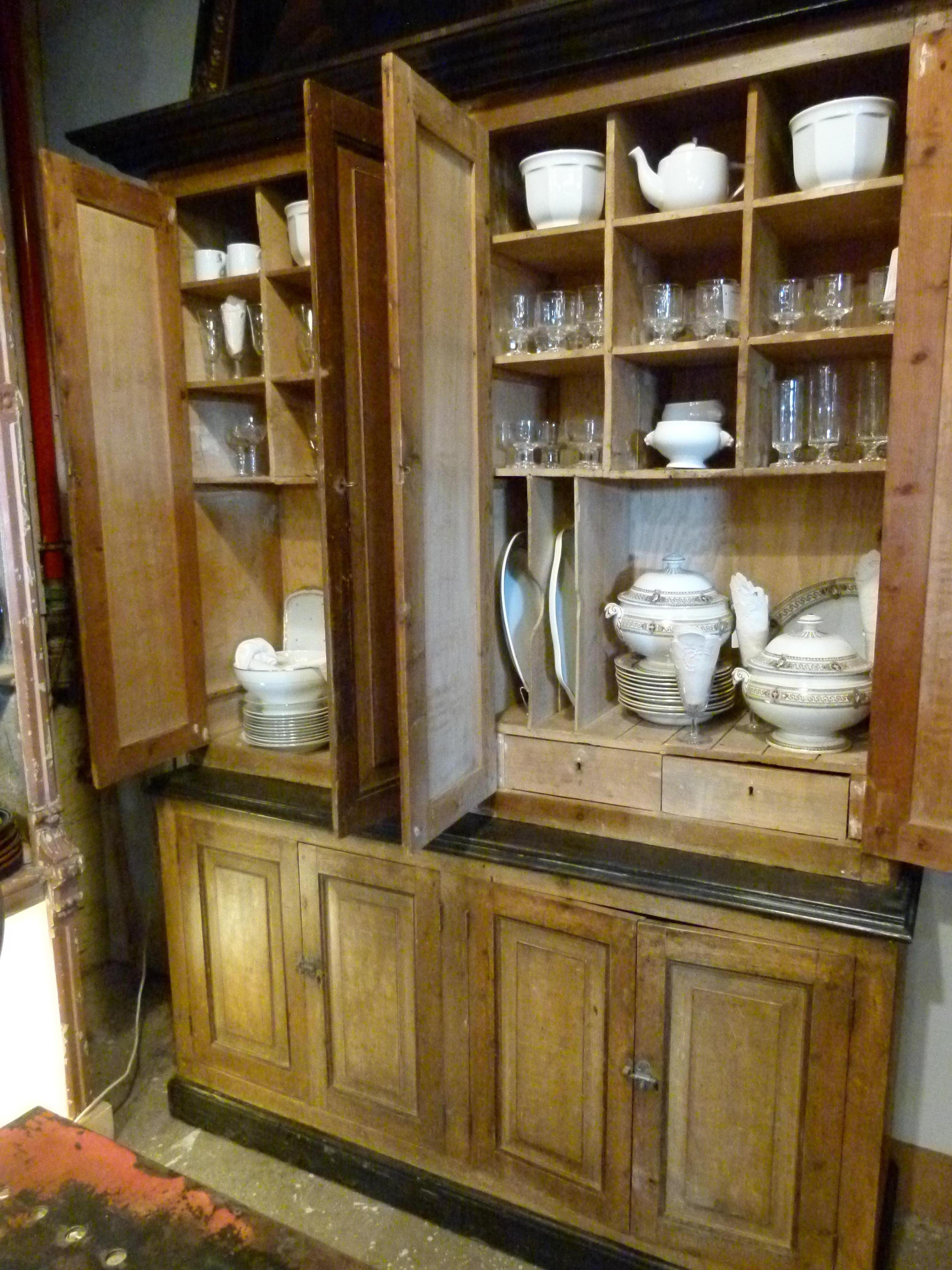 Early 20th century wooden antique patina Spanish cabinet it comprises 8 doors, that open to nice compartments for service keeping as well as two drawers for cutlery.
On the bottom two cupboards with shelves

Measures: 165 x 50 x 231 cm.
   