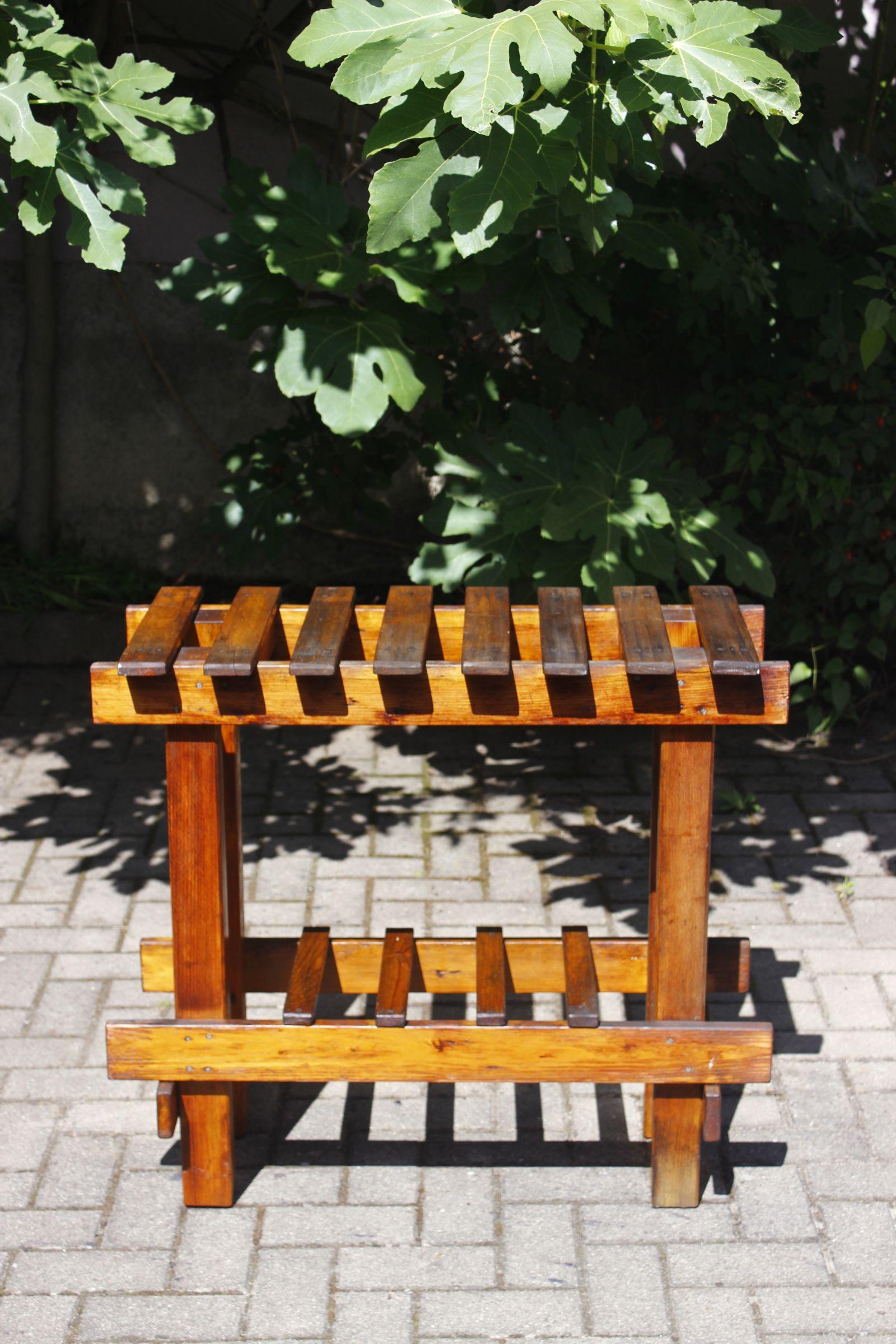 French folk art console table typical of early 20th century farm furniture, made in nailed solid pinewood. The bottom part can be used to store wine bottles. In great condition for its age, has a wonderful patina. Has been cleaned and treated. 