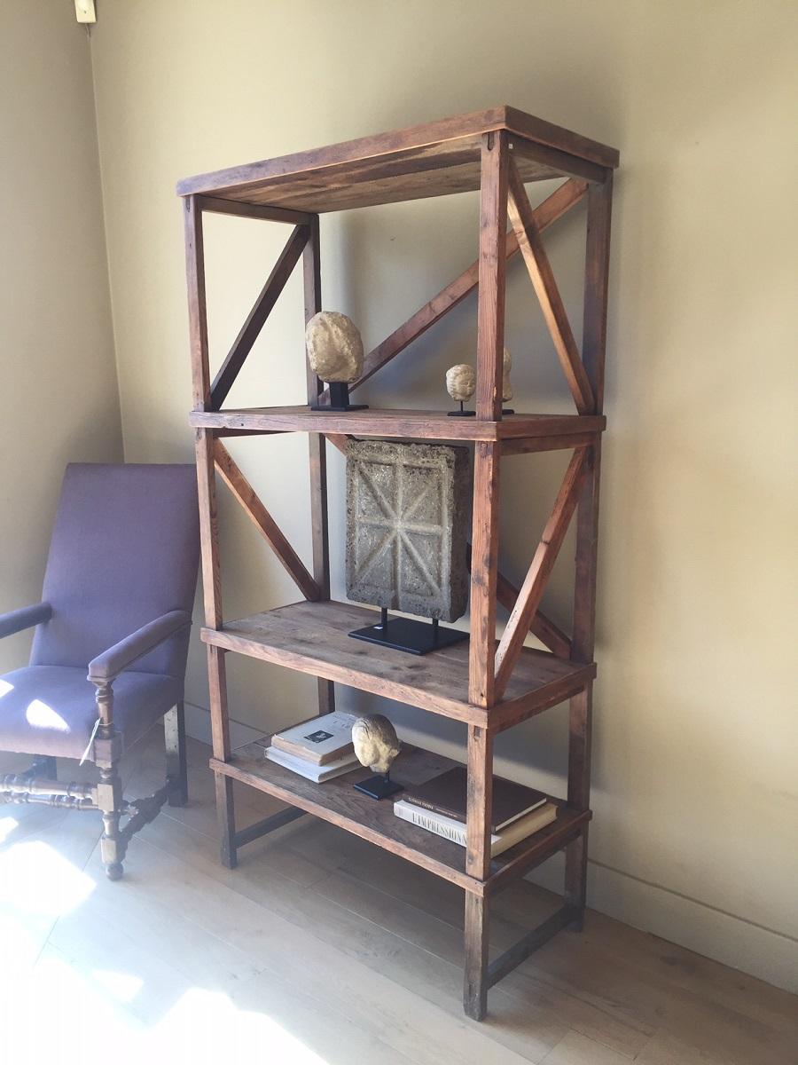 A large early 20th century Italian softwood shelf unit. Probably from a Industrial background this shelf storage unit is artisanally constructed with well patined mountain softwood.