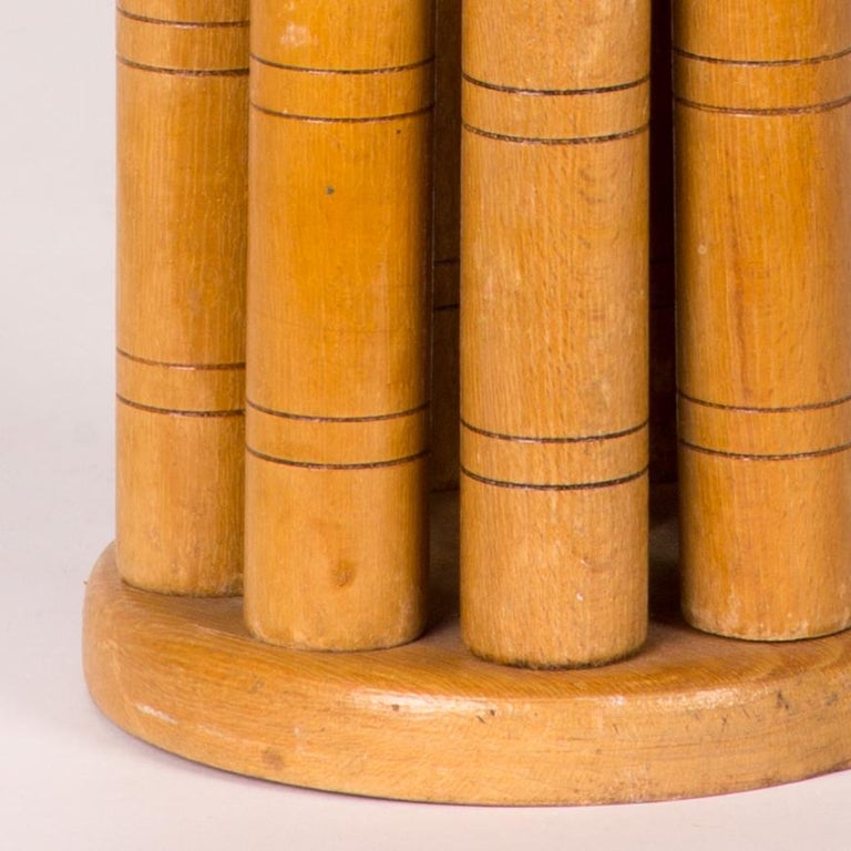 Early 20th-century blonde wooden skittle set with stand. Skittle is an English lawn game that is still popular throughout the United Kingdom today, only in its current iteration it is played as a miniature pub game. A fun and functional decorative