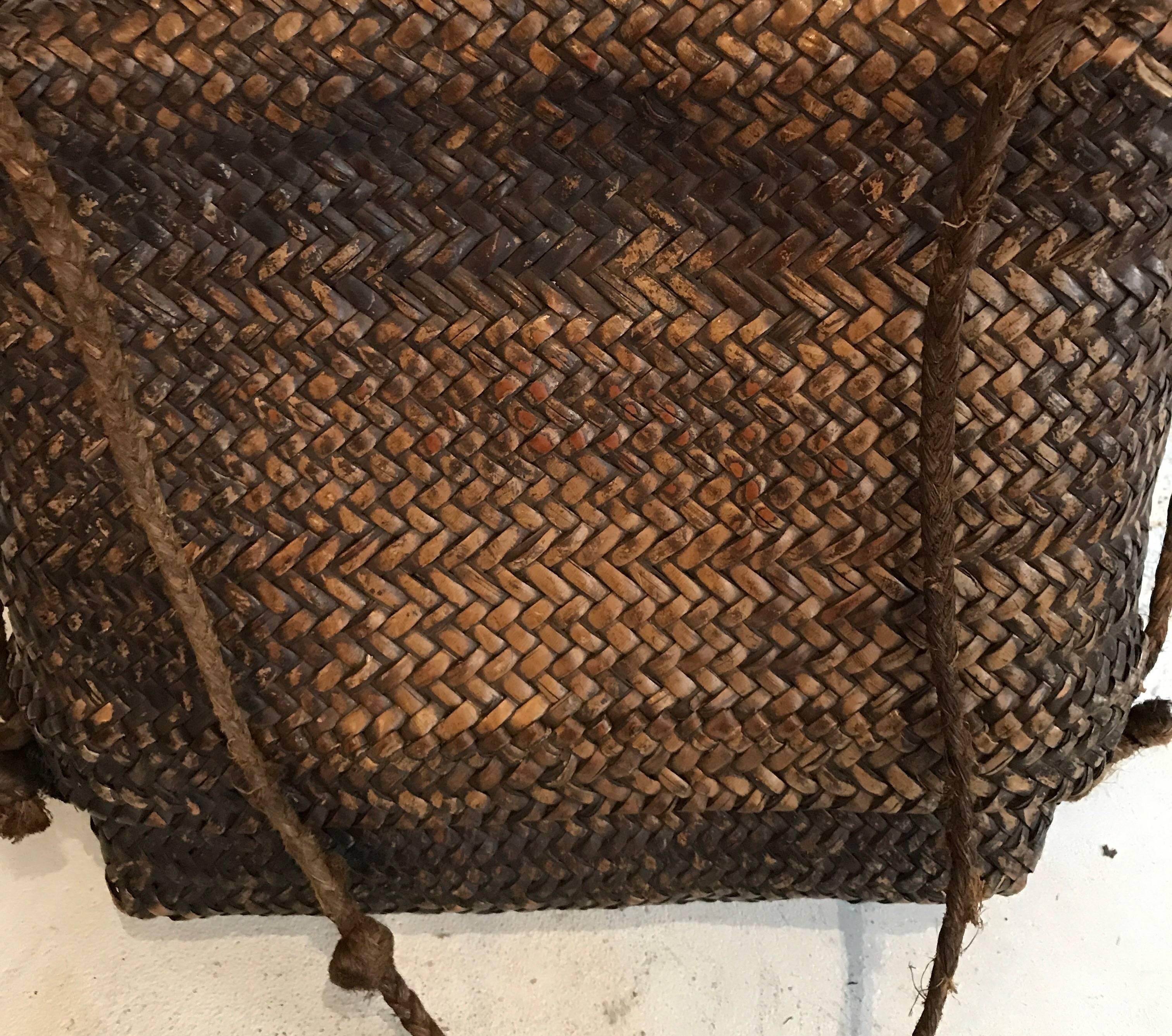 Early 20th century woven Thai basket 
Beautiful patina 


Dimensions: Top is 10.5 in H x 14 in W
 Bottom is 10 in H x 13.5 W
 Total for basket is 12.5 in H x 14 in W x 4.5 in D with handle 28 in H.
