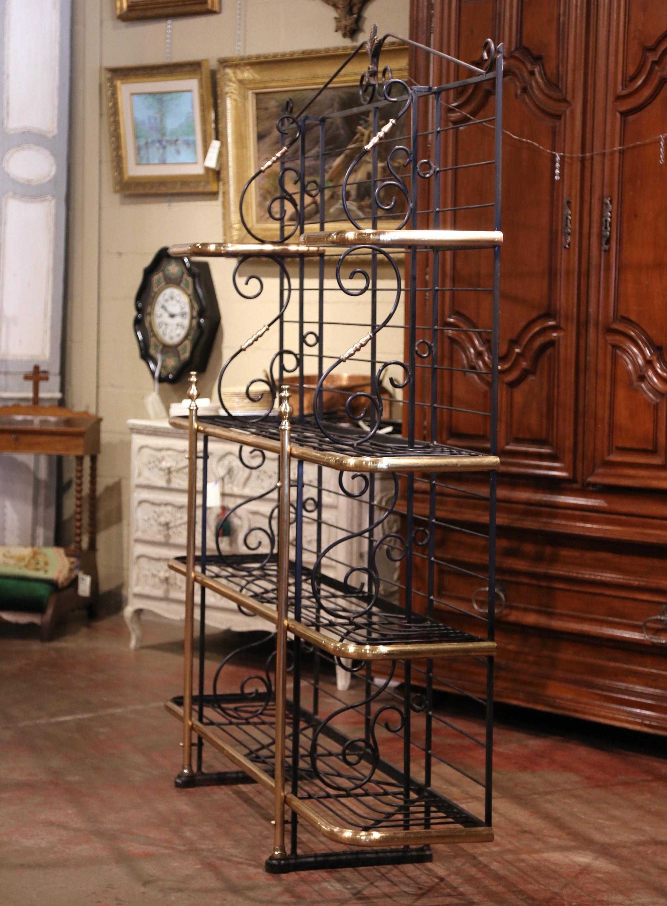 Display your Majolica collection, cooking books, or other accessories on this elegant antique Parisian Boulangerie rack; crafted circa 1930, the wide shelf made primarily of iron, features decorative brass columns and edging shelf trim, bronze