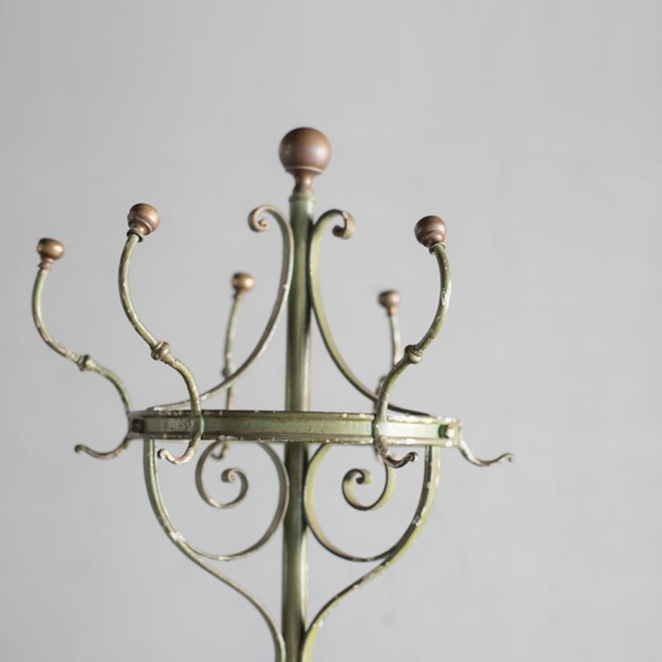 Wrought iron hat and coat stand with brass finals made in France in early 20th century.
The decorative design of wrought iron is very nice. One hook is missing.