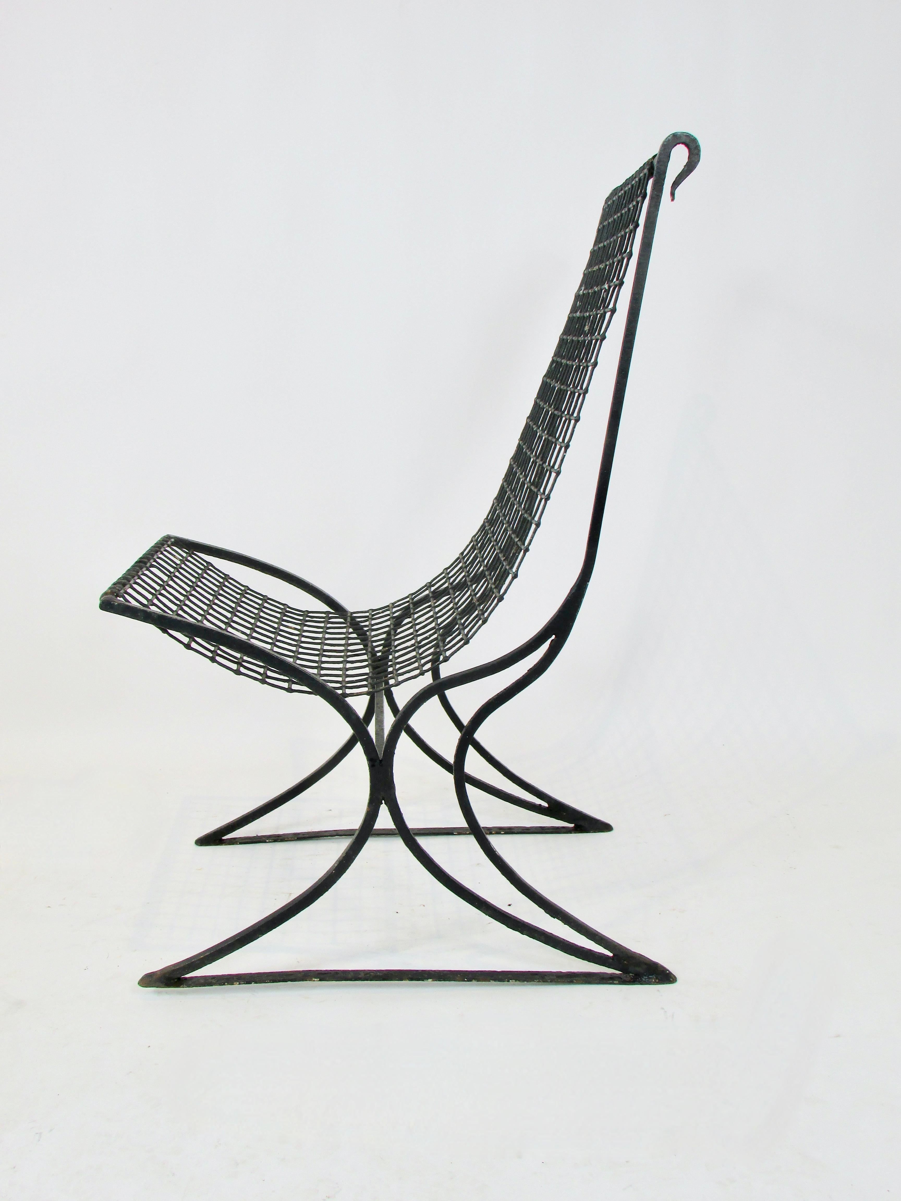 Early 20th century wrought iron with wire seat garden chair in old black paint For Sale 2