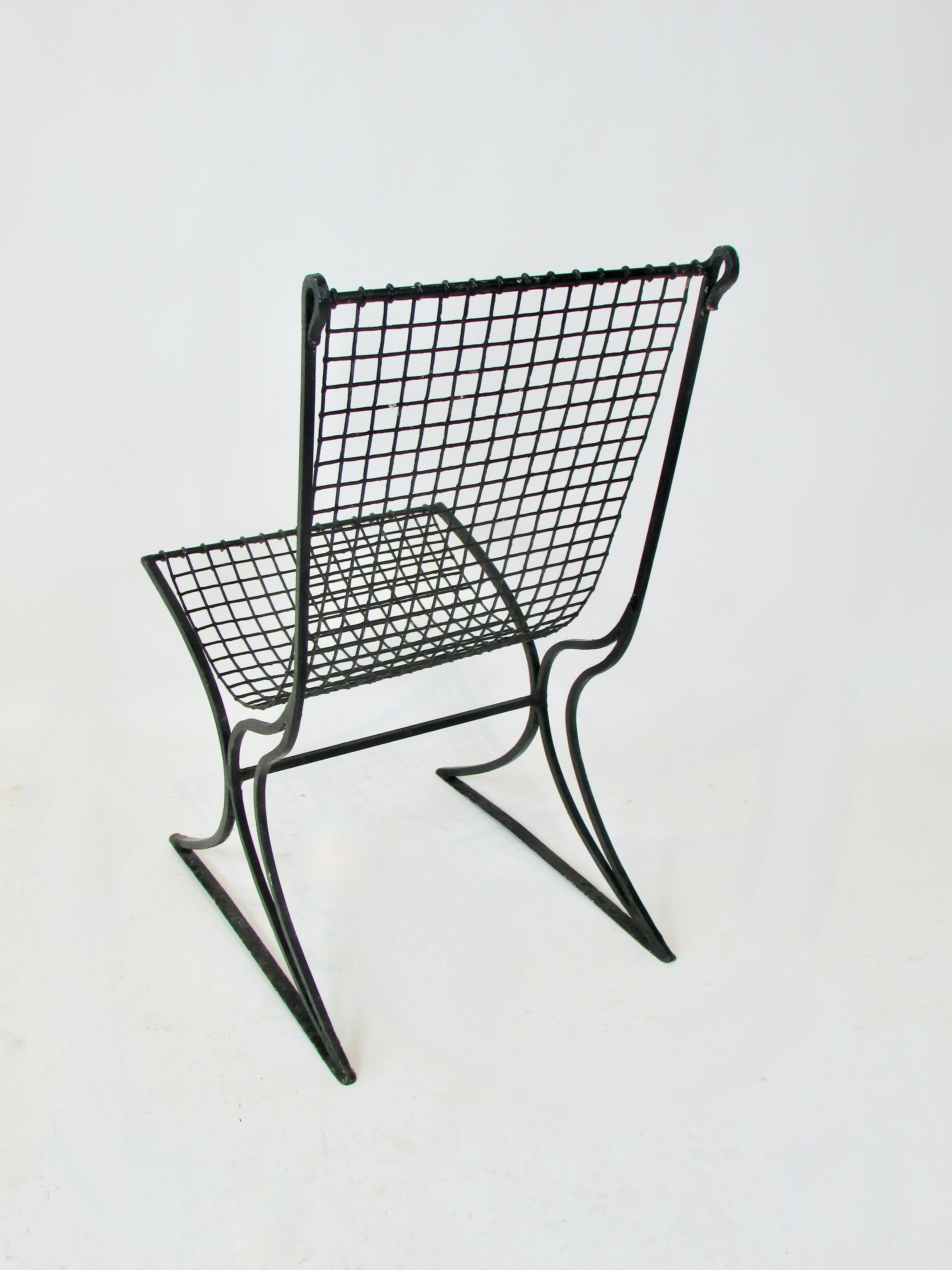 Painted Early 20th century wrought iron with wire seat garden chair in old black paint For Sale