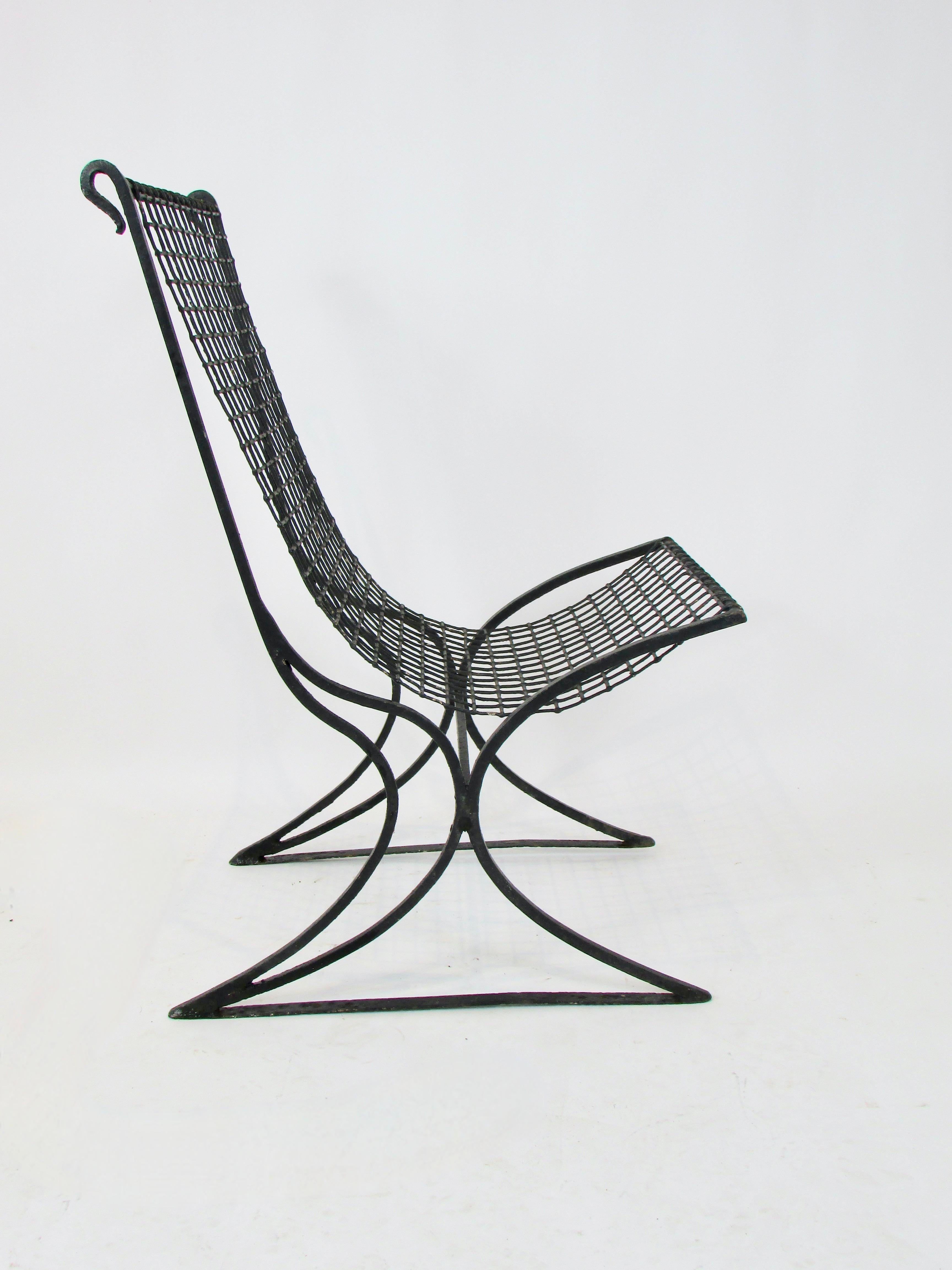 Wrought Iron Early 20th century wrought iron with wire seat garden chair in old black paint For Sale