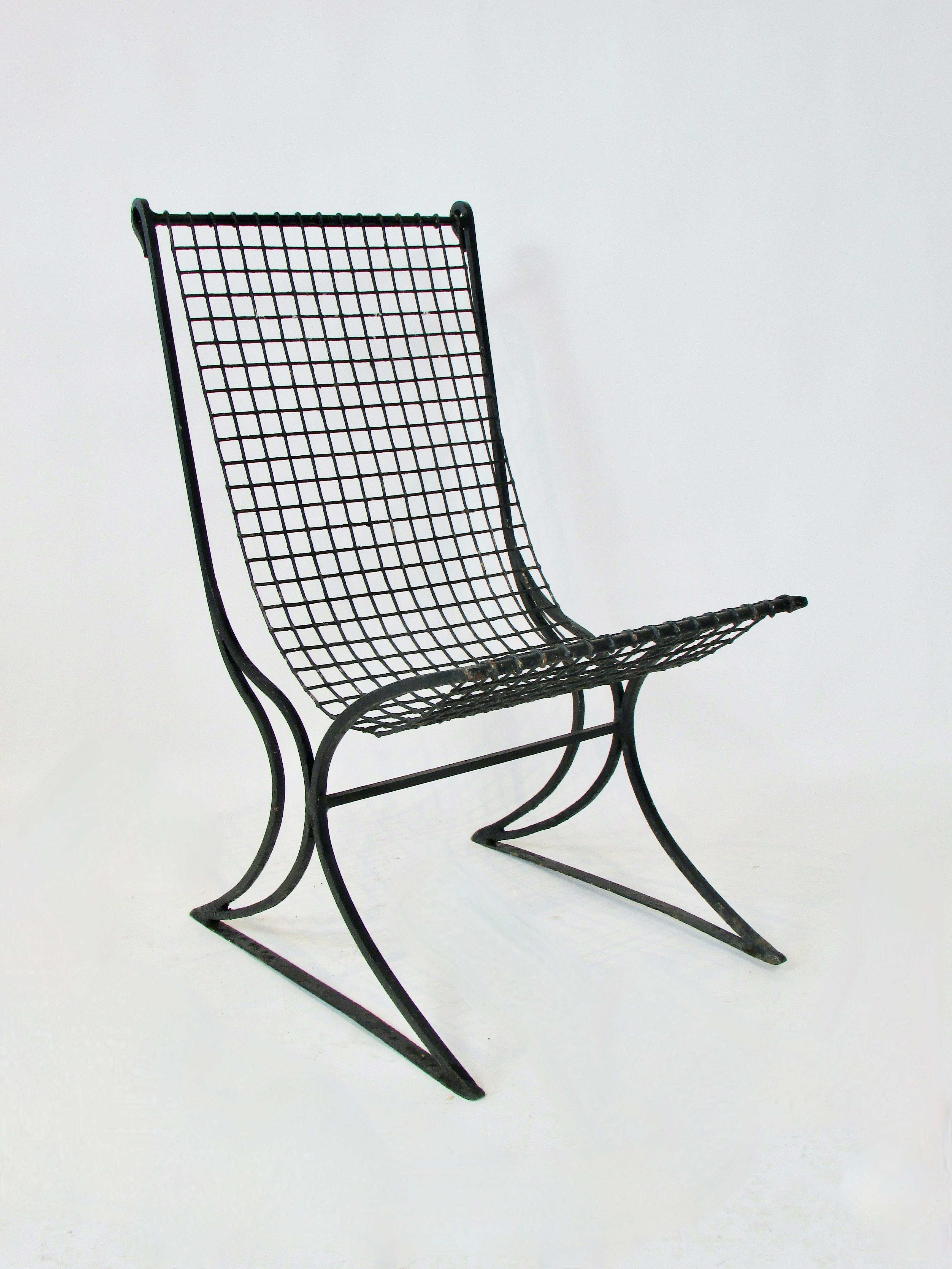 Early 20th century wrought iron with wire seat garden chair in old black paint For Sale 1