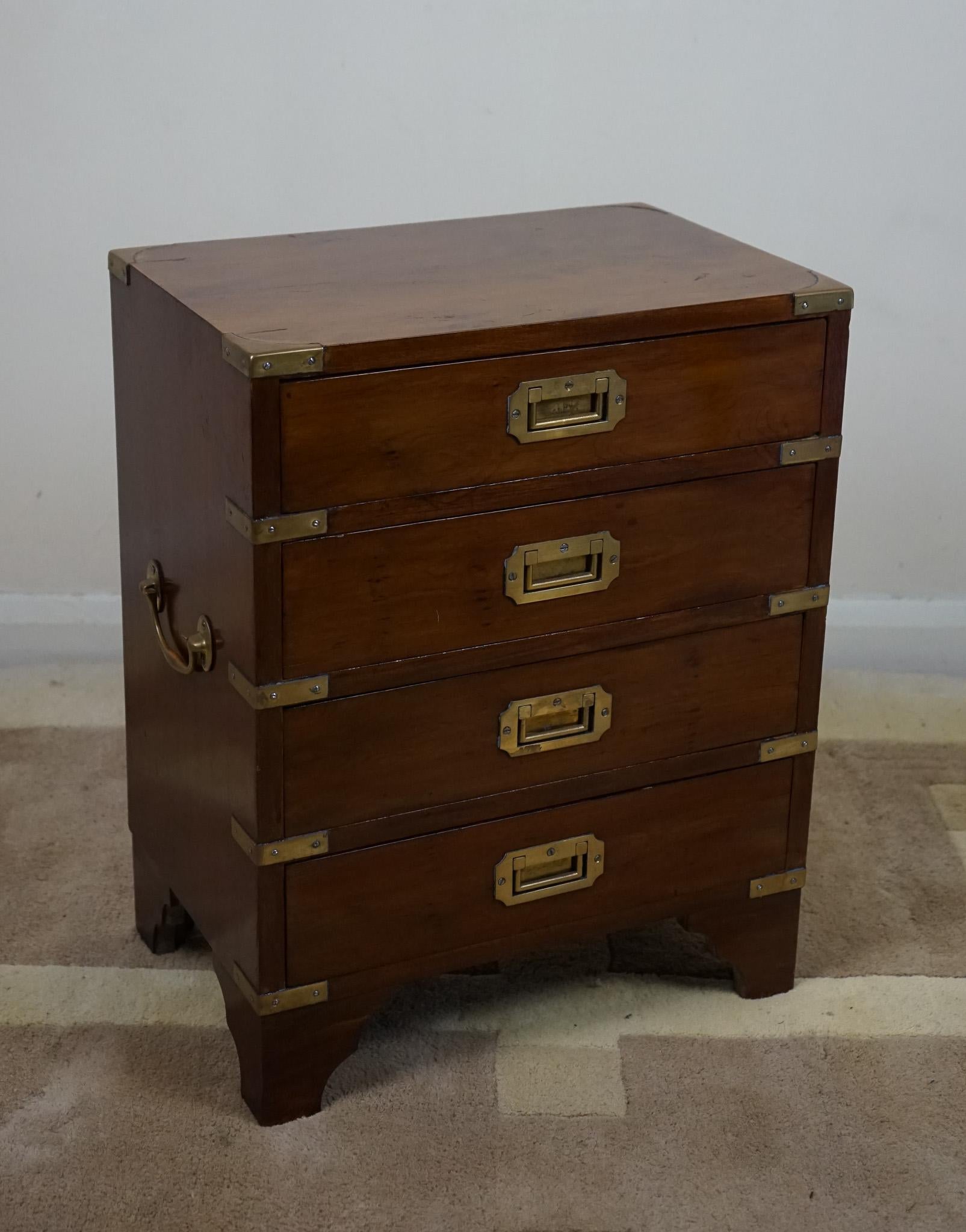 A early 20th century yew and brass bound Campaign style bedside chest of four drawers . It is of lovely quality, with lovely brass handles and fixtures. This sits on bracket feet, and is very practical, with plenty of storage space inside the four