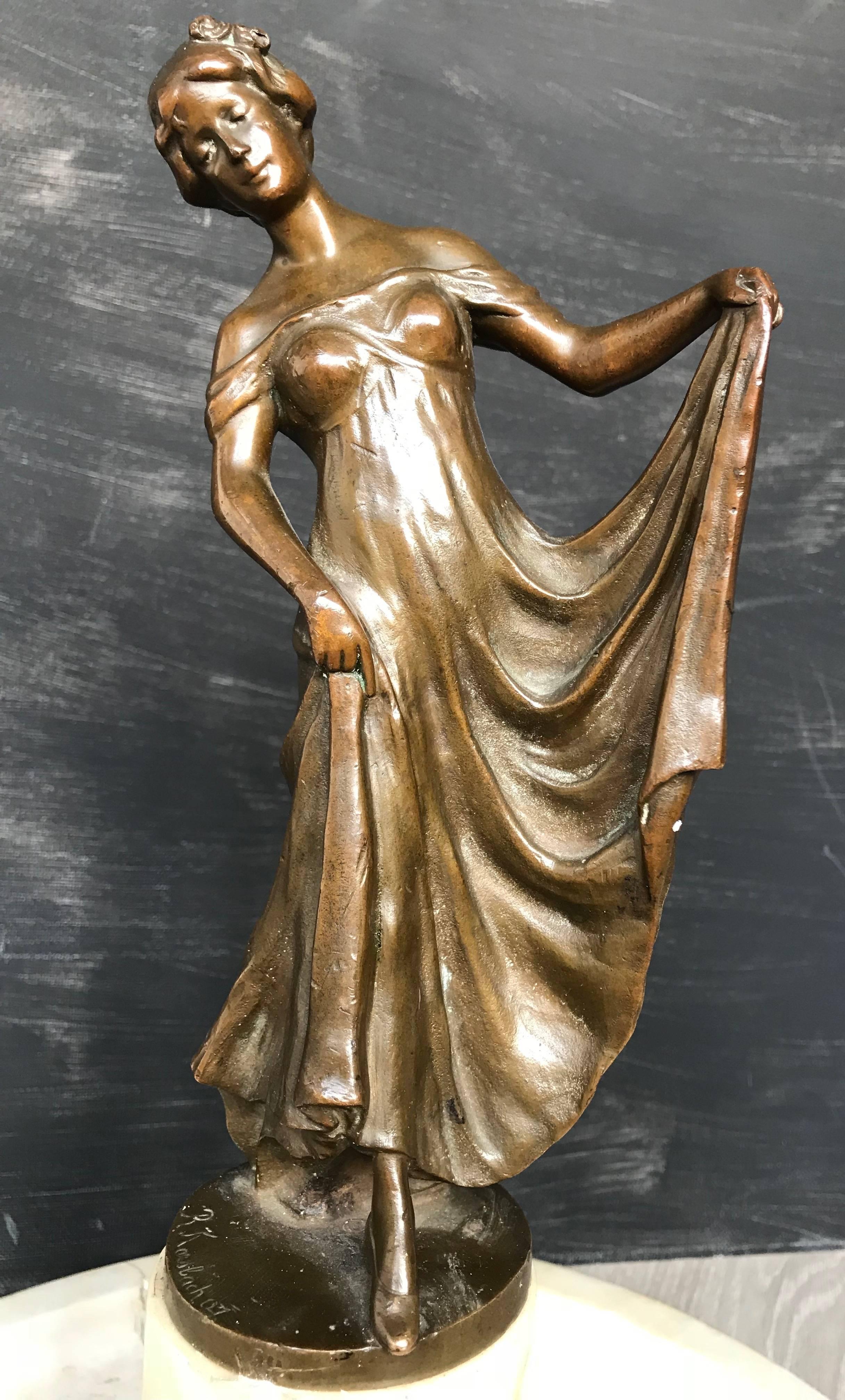 Marked and highly decorative antique Jugendstil sculpture. 

This fine work of Jugendstil art radiates pure elegance and innocence. The natural posture of this flowing lady sculpture and the way her dress perfectly drapes around her body reveals the