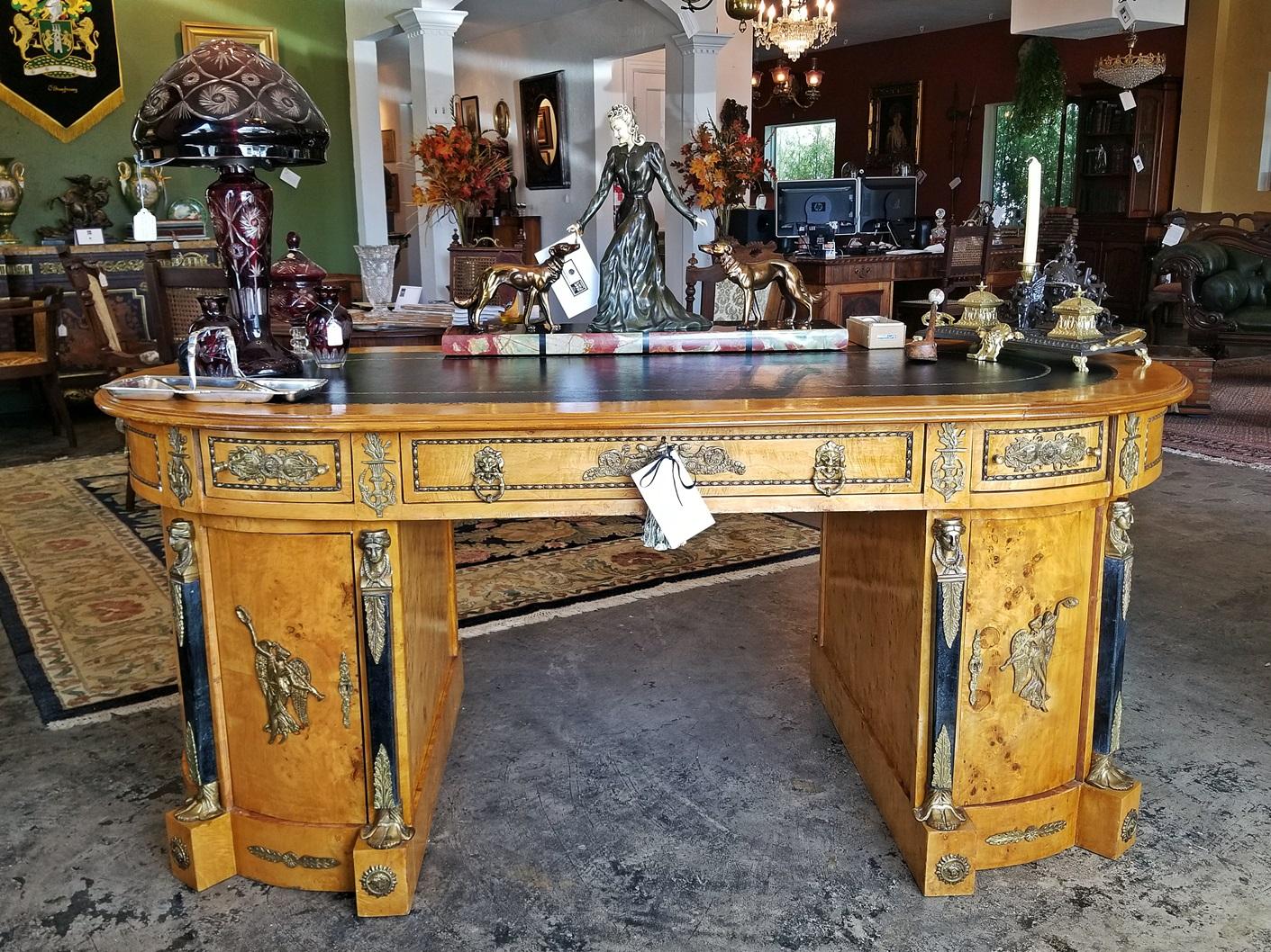 Beautiful French neoclassical revival style partners desk.
Probable made in the early 20th century, circa 1920 in the Empire style, with neoclassical influences. Made of rare burr yew wood, with a gorgeous yellow-brown patina. Ormolu mounts and