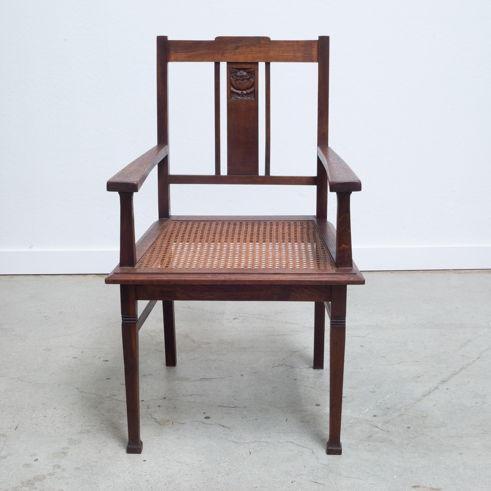 Glasgow Style Arts and Crafts caned oak arm chair with carved motif on the back and legs. Flared feet in the front. c.1900
Scottish school -- Wylie and Lochhead/ E.A. Taylor attributed.

Contact us for more shipping options: S16 Home San Francisco
 