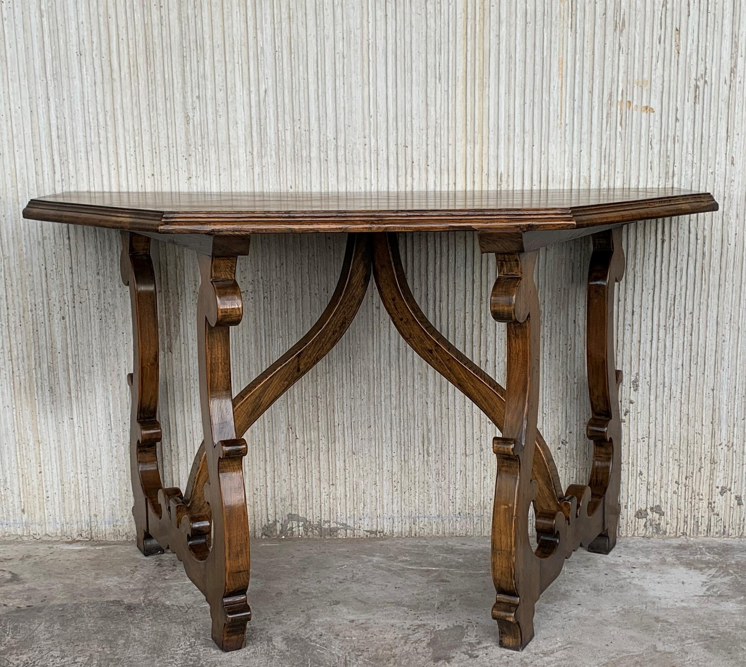 Early 20th convertible Spanish walnut console tables in center table or dining table.
Both consoles made of solid walnut with beautiful original patina.
In two self-supporting parts, flanked by trapezoid section on either side, each with plank top