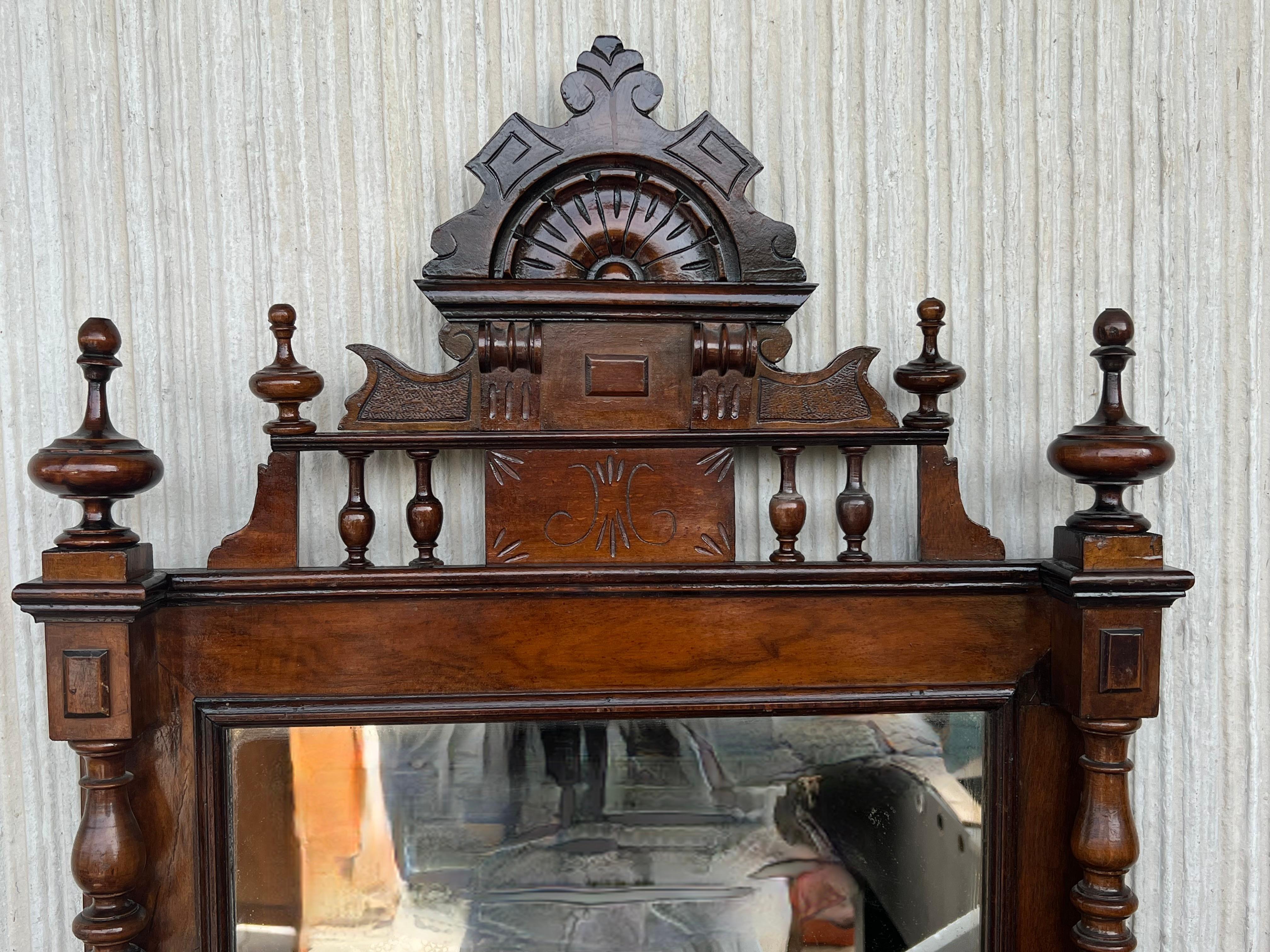 Early 20th French Ebonized Mirror with Turned Columns and High Carved Details In Good Condition For Sale In Miami, FL