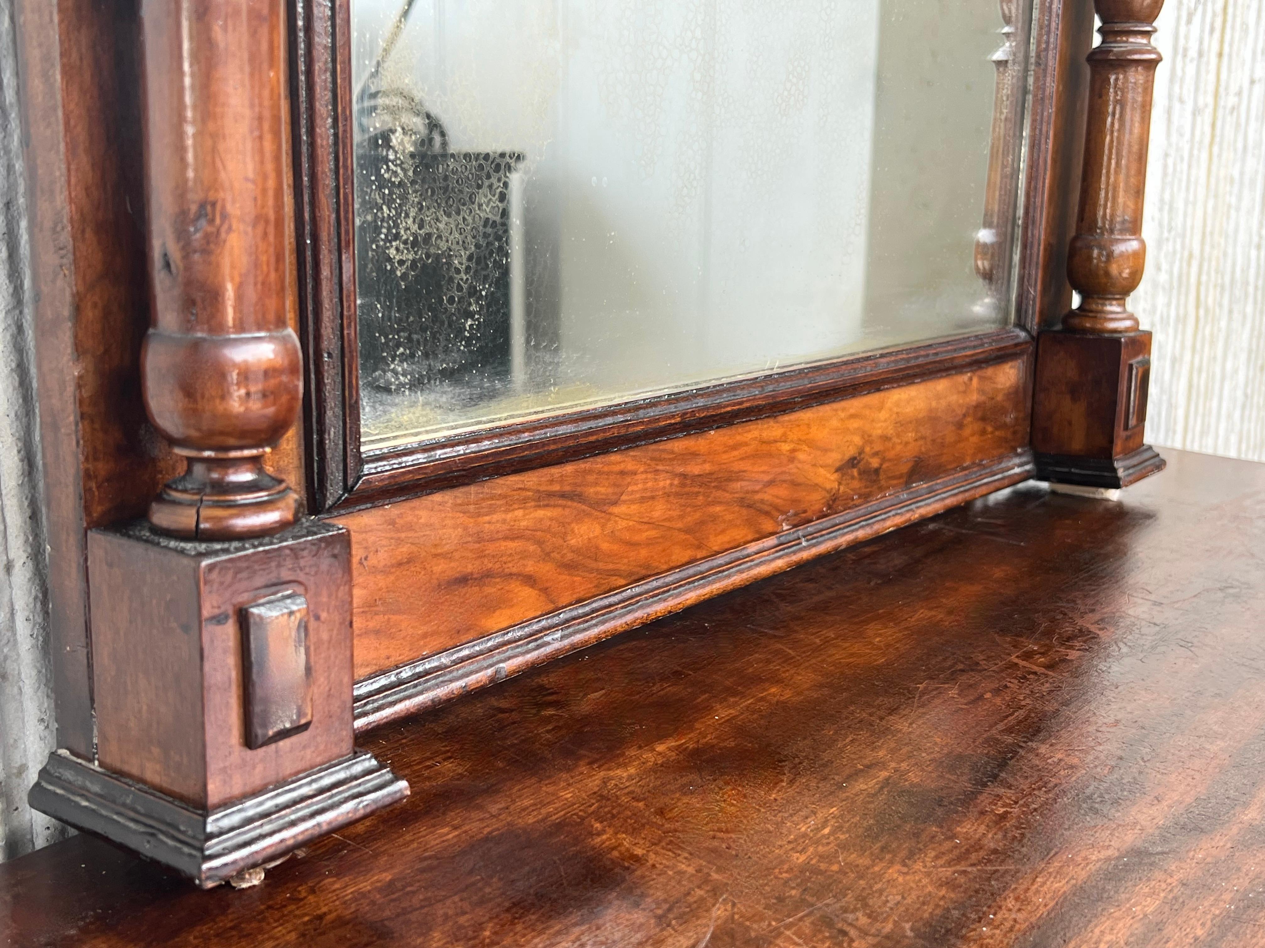 Walnut Early 20th French Ebonized Mirror with Turned Columns and High Carved Details For Sale