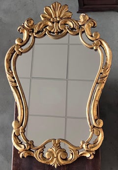 Specchio in legno dorato intagliato del periodo Impero francese dei primi del Novecento