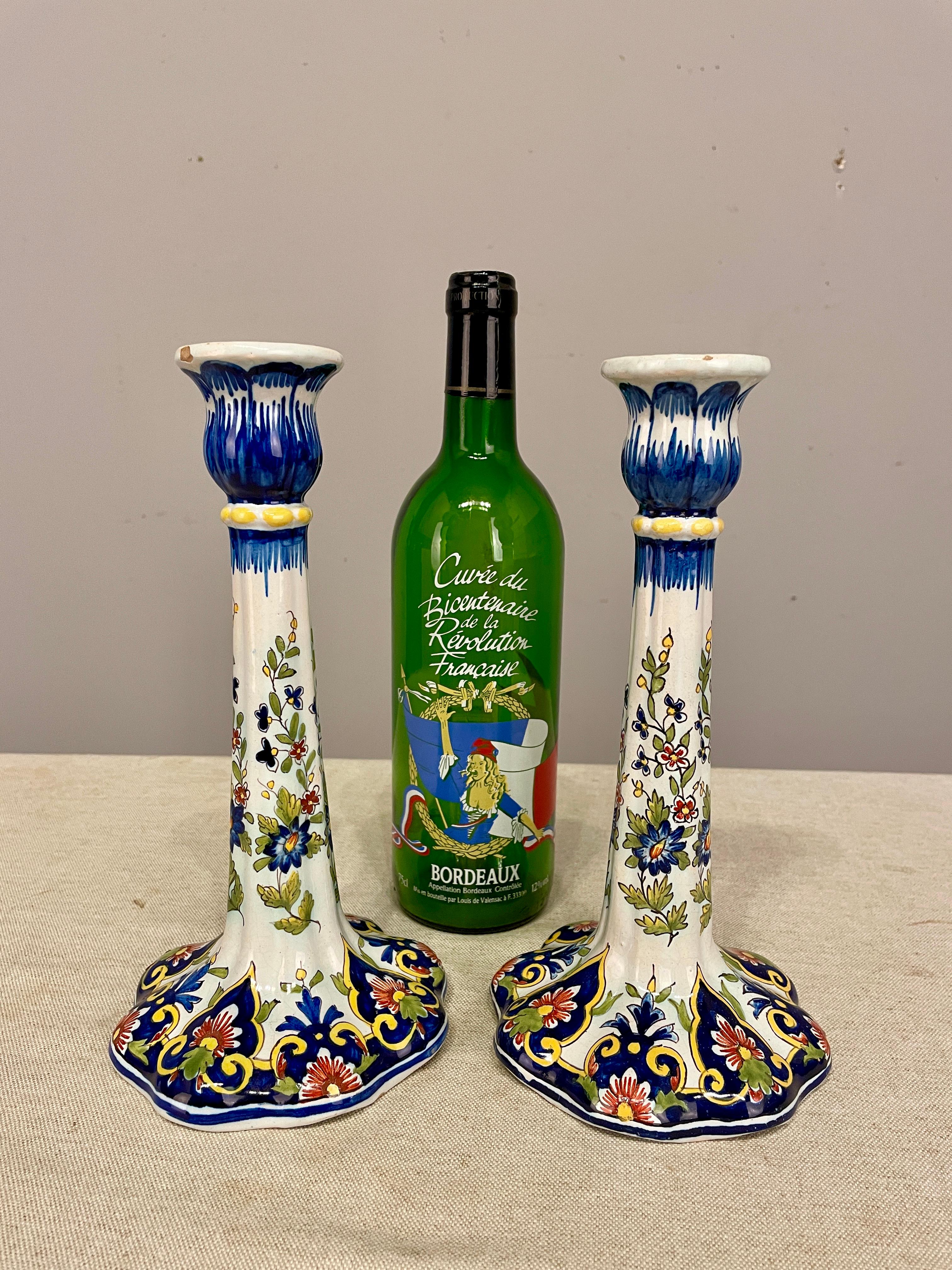 An early 20th pair of French Faience Candlestick with the Rouen Decor, from the faiencerie of Desvres, signed on bottom Mosanic. Note : one chip on the top. See last picture. 
Dimensions are 5