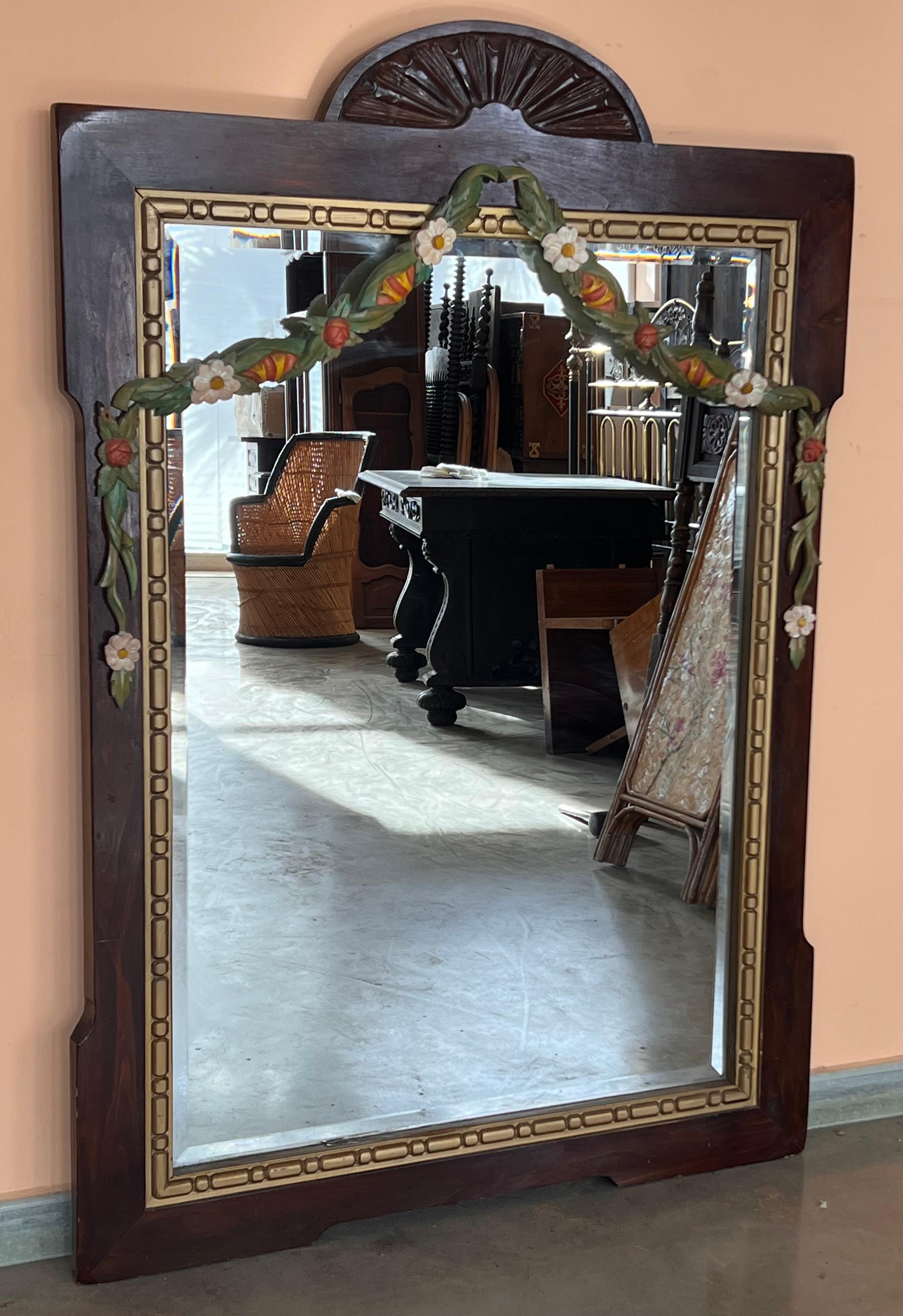Wood frame that features decorative elements such as garlands and giltwood garland merge . The magnificent size, expertly executed woodwork and beautiful condition of this mirror make it a prized specimen of 19th-century French design. 