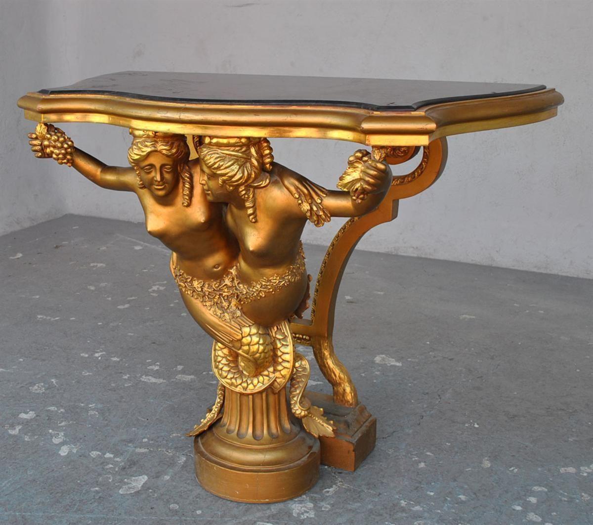 Carved siren console. From Count Angiviller's collection model. Giltwood and black marble top. Dating from the beginning of the 20th century.