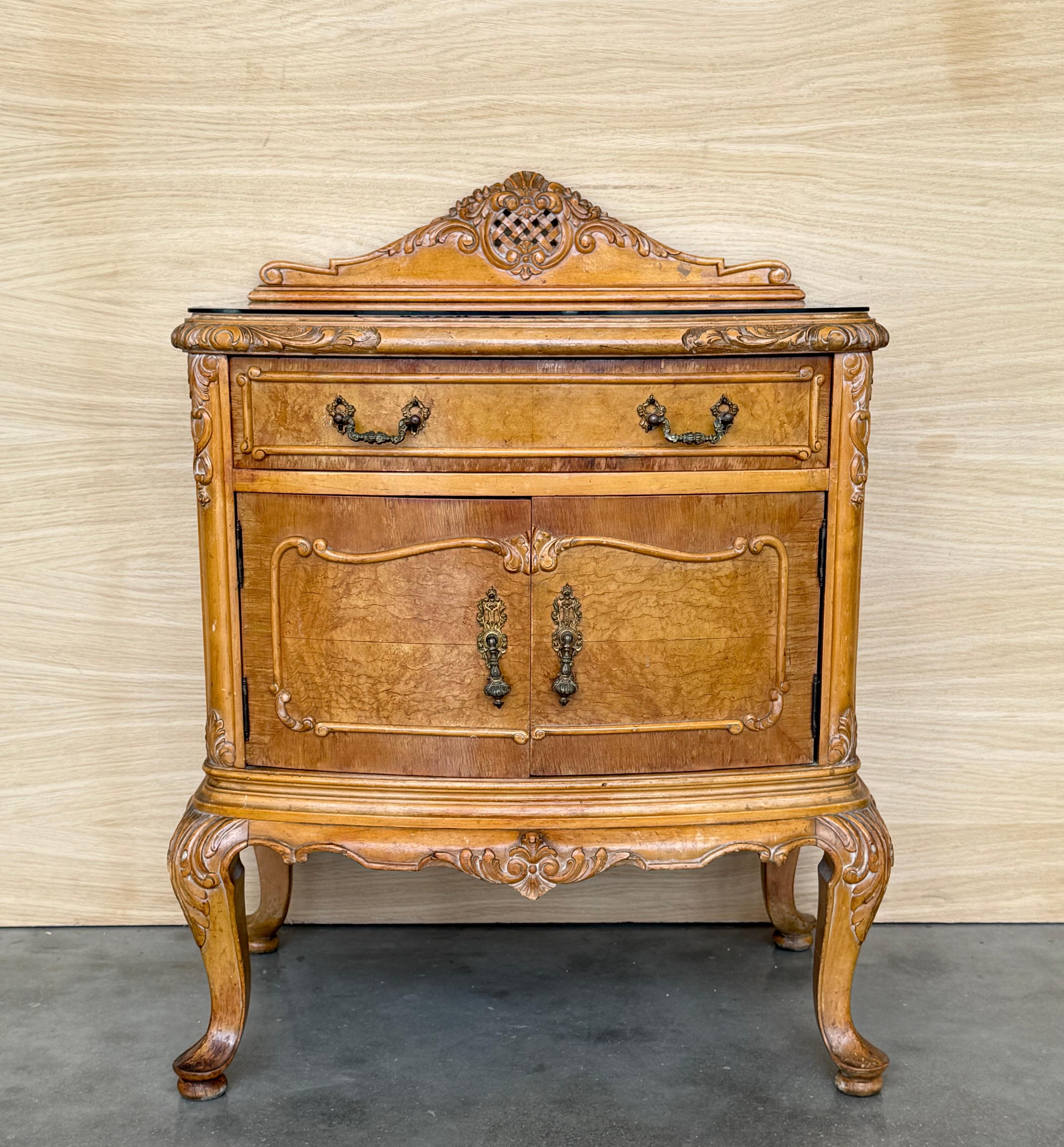 Fine pair of French neoclassical night stands or side tables, art deco styling, exude luxurious style from every angle! 
The polished nightstands with gorgeous doors fronts creating exquisite patterns . 
Both cabinets sitting on tapering legs.
