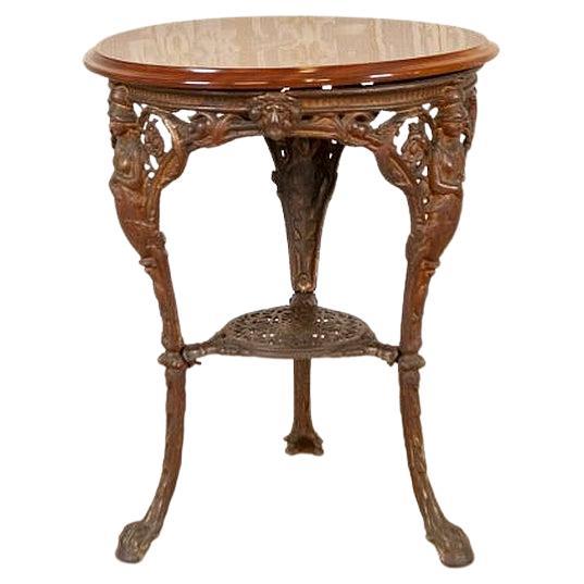 Early-20th Oval Coffee Table on Cast Iron Base