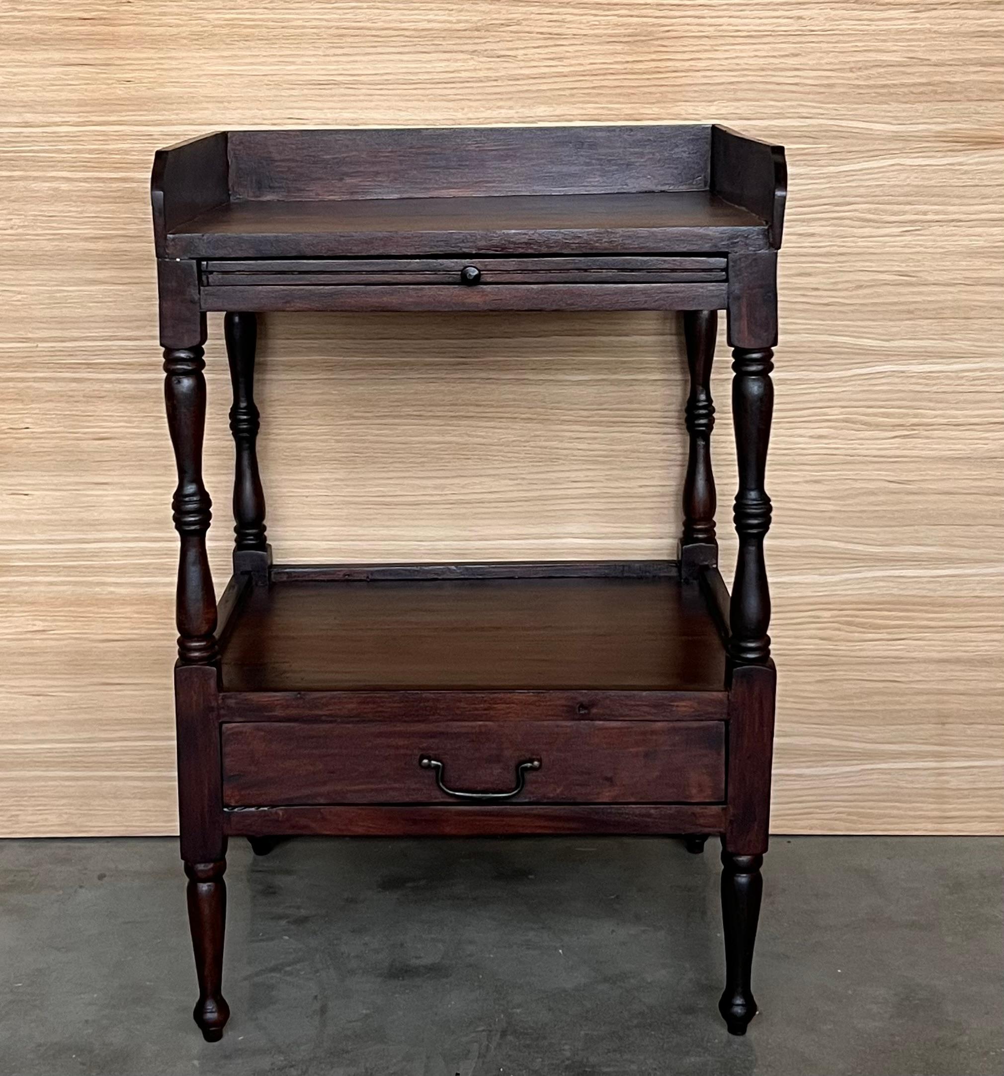 Oak Nightstands with Gallery Top and sliding hide tray. It has a low drawer 

Height to the top: 26.77 in
Height to the drawer : 16.14in.