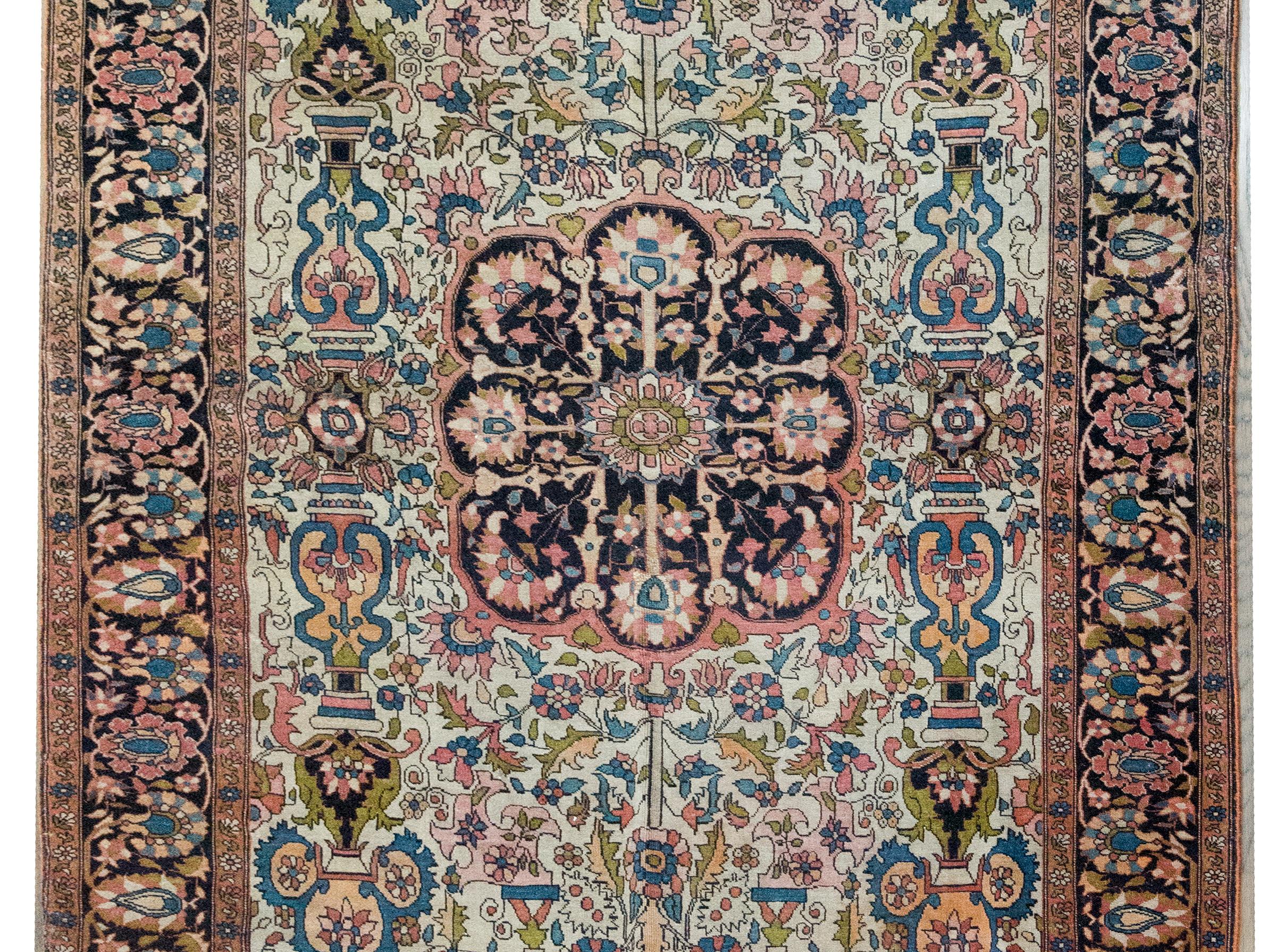 Woven circa 1900, this Sarouk Farahan rug is a refined example of one of the most collectible Persian rug styles. Made in the Farahan district of west-central Iran by highly skilled Persian artisans, Sarouk Farahan rugs are known for their crisp