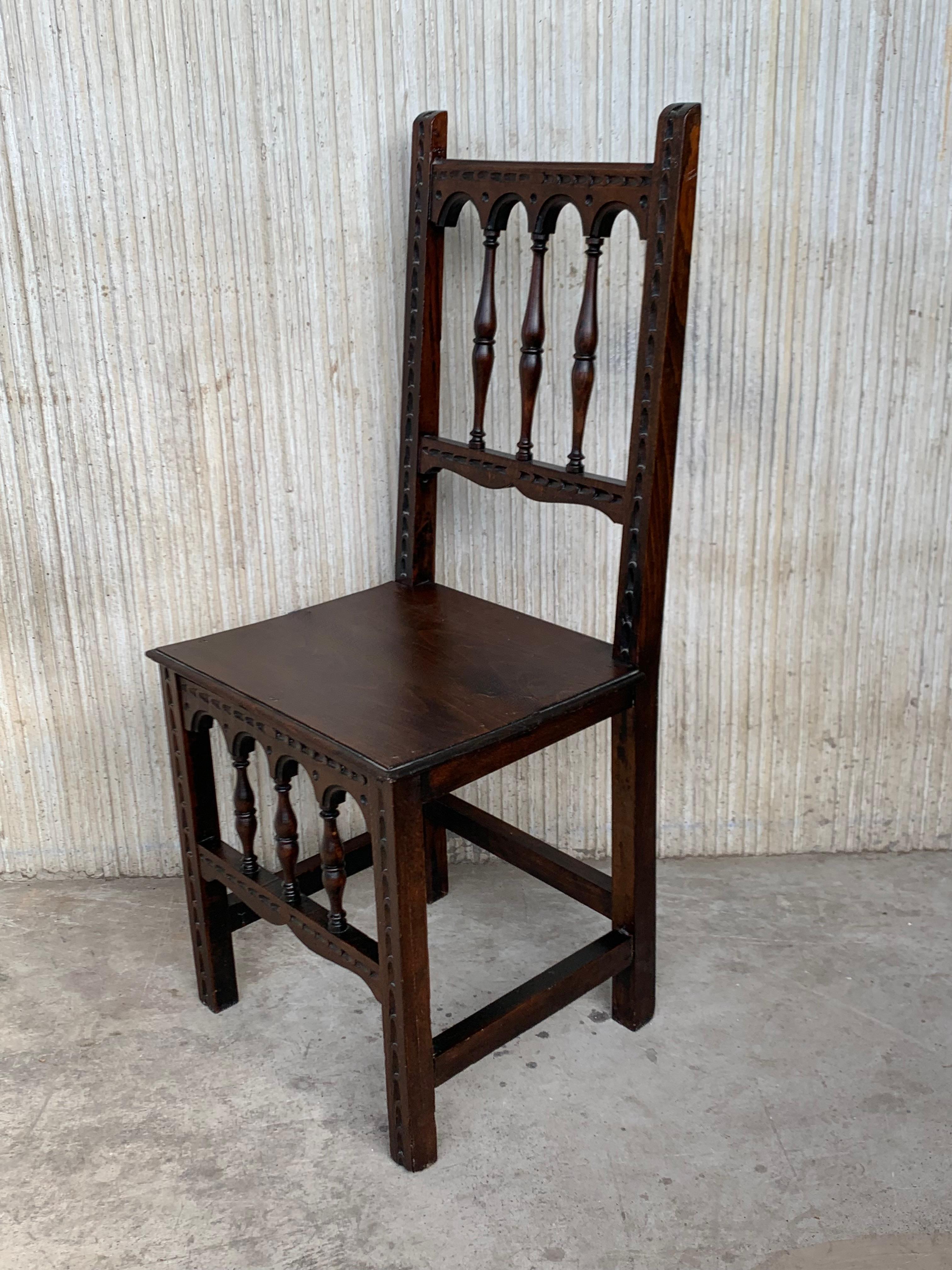 20th Century Early 20th Set of Four Spanish Carved Chairs with Wood Seat For Sale