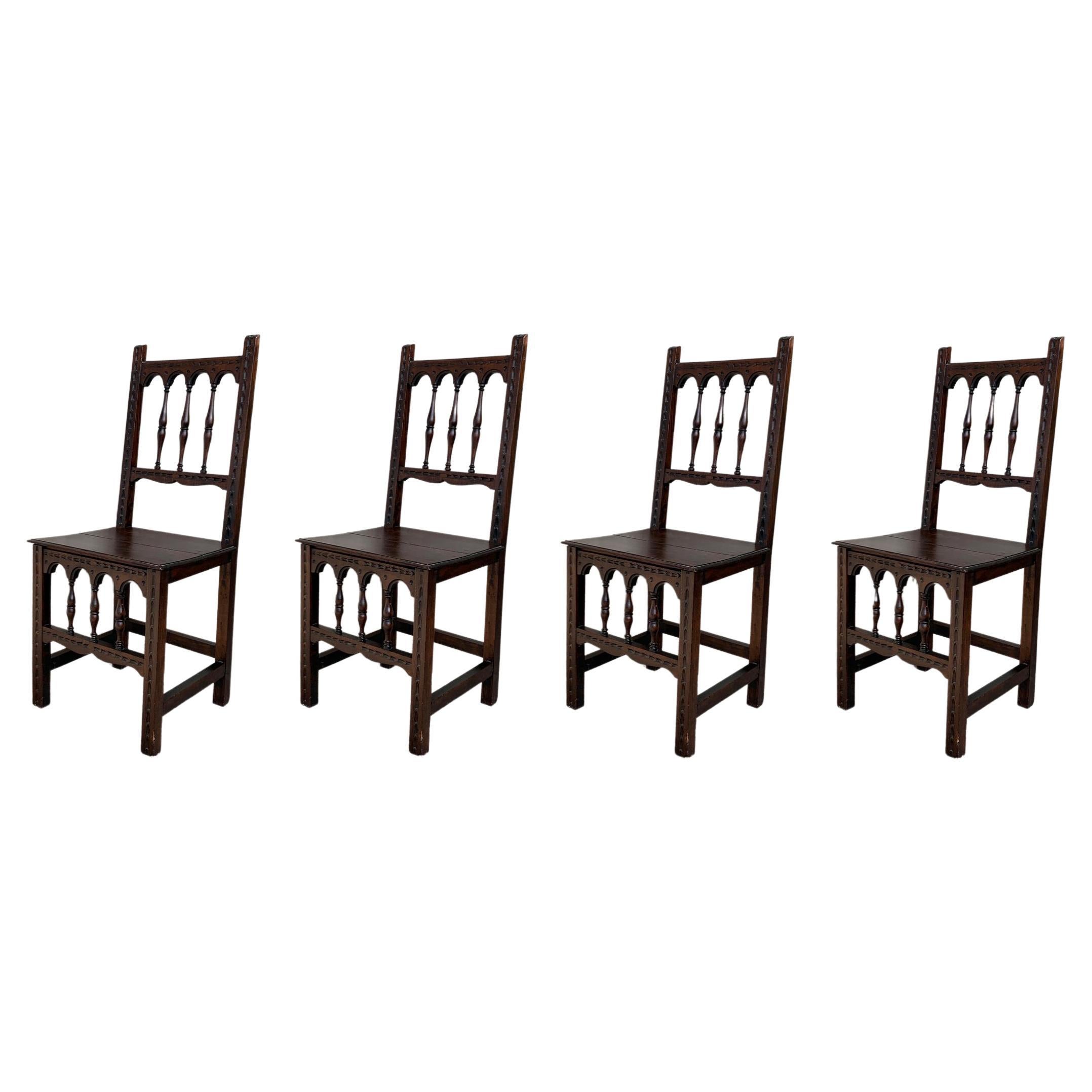 Early 20th Set of Four Spanish Carved Chairs with Wood Seat