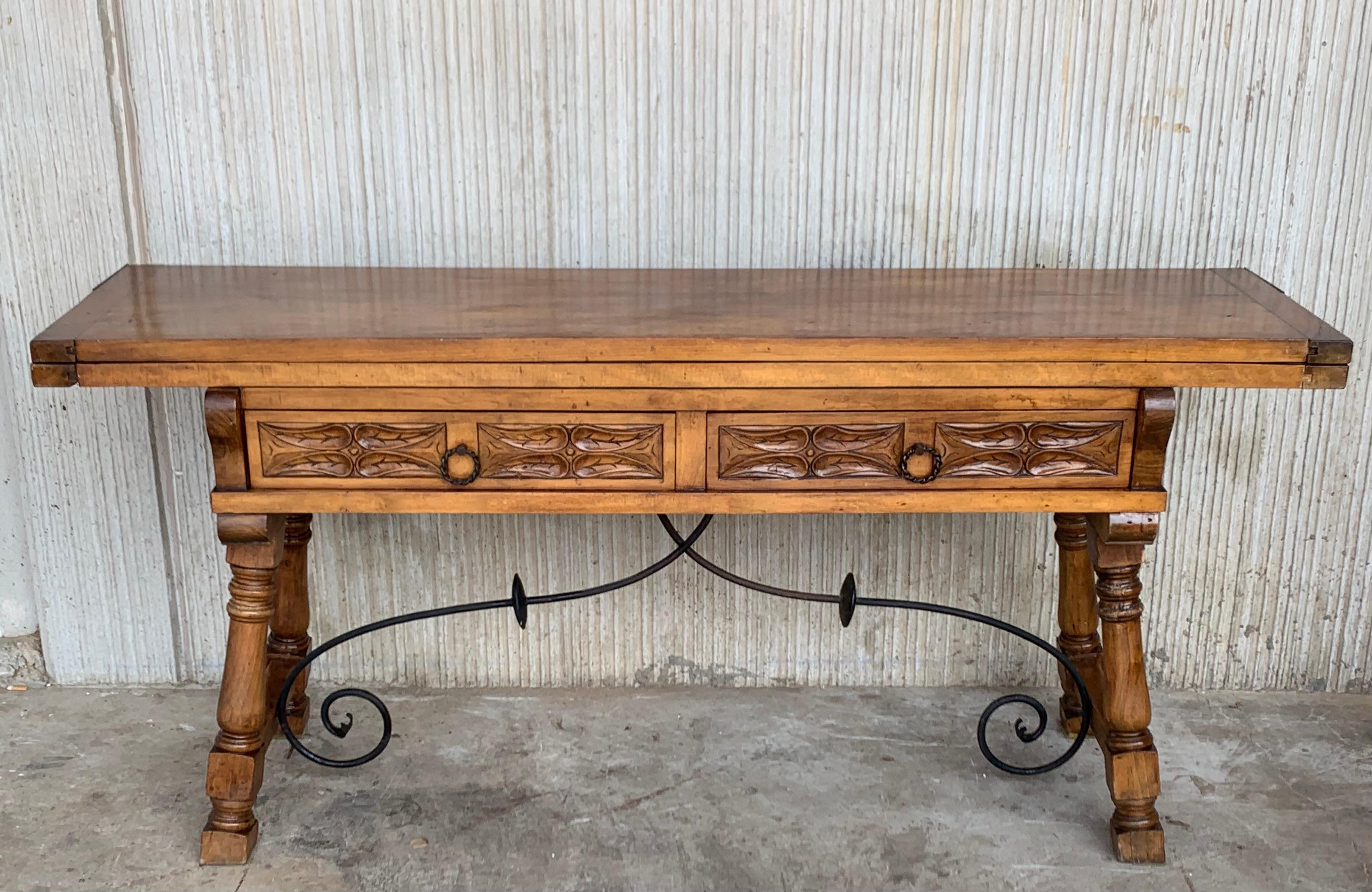 20th century Spanish console fold out farm table
Works as both a dining table and console.
The table is carved in front and back with the same carved.
  