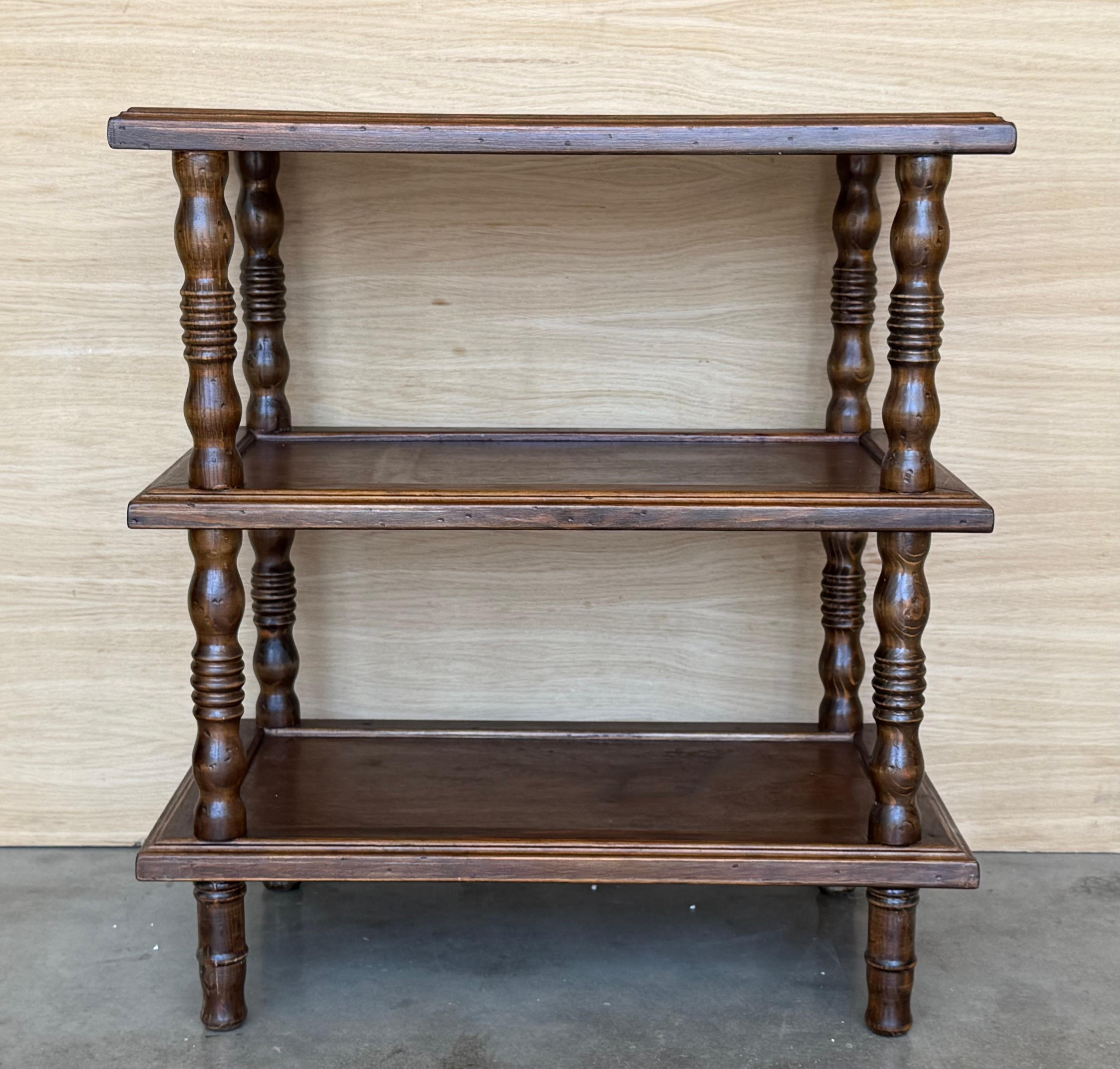 Early 20th Spanisht Walnut Side Table with Three Shelves and turned legs. 
Each shelve has an edge to keep your things save.
Heavy piece completely restored .

Shelves height : 17.51in ( middle shelve ) and 6.3in (low shelve)